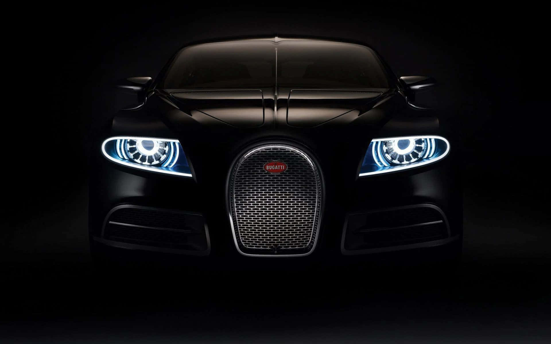 Black Car 桌布 壁紙 — 一輛時尚的黑色Bugatti跑車在漆黑背景中散發出明亮的藍色車頭燈光芒。