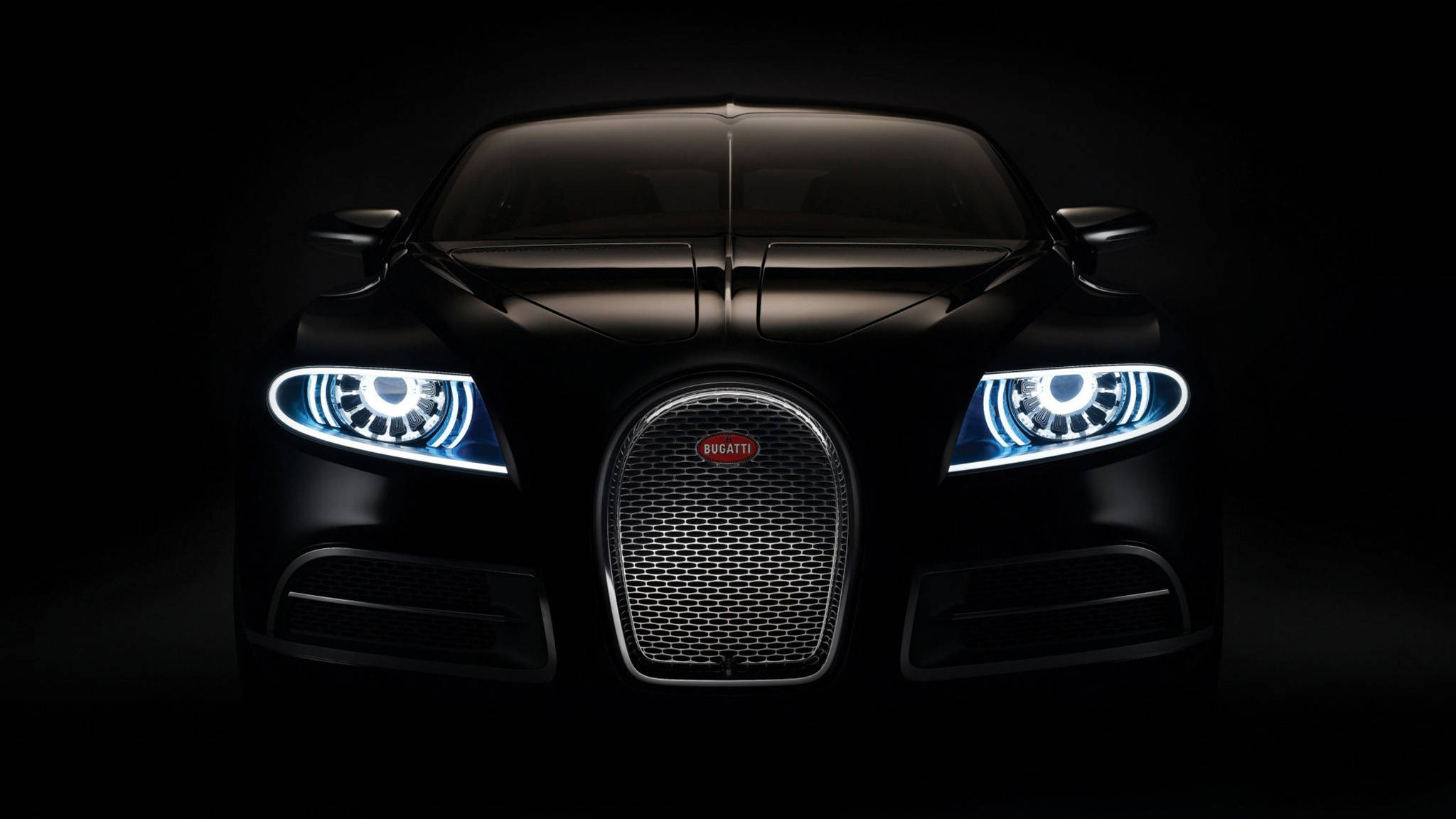 cars 桌布 壁紙 — 一輛時尚的黑色Bugatti跑車，在漆黑的攝影棚背景下閃耀著明亮的藍色車頭燈。