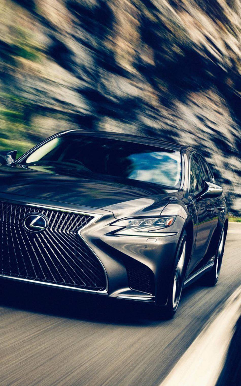 凌志 桌布 壁紙 — 一輛時尚的黑色Lexus轎車沿著蜿蜒的道路飛馳，模糊的岩石懸崖在運動中呼嘯而過。