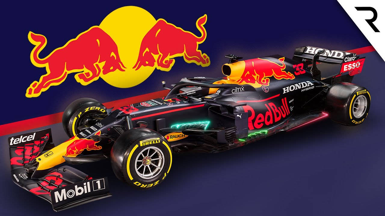 鎖屏 桌布 壁紙 — 一輛時尚的黑色和紅色Red Bull Racing一級方程式賽車，帶有發光霓虹燈飾和贊助商標誌，背景為深藍色，帶有標誌性的Red Bull標誌。