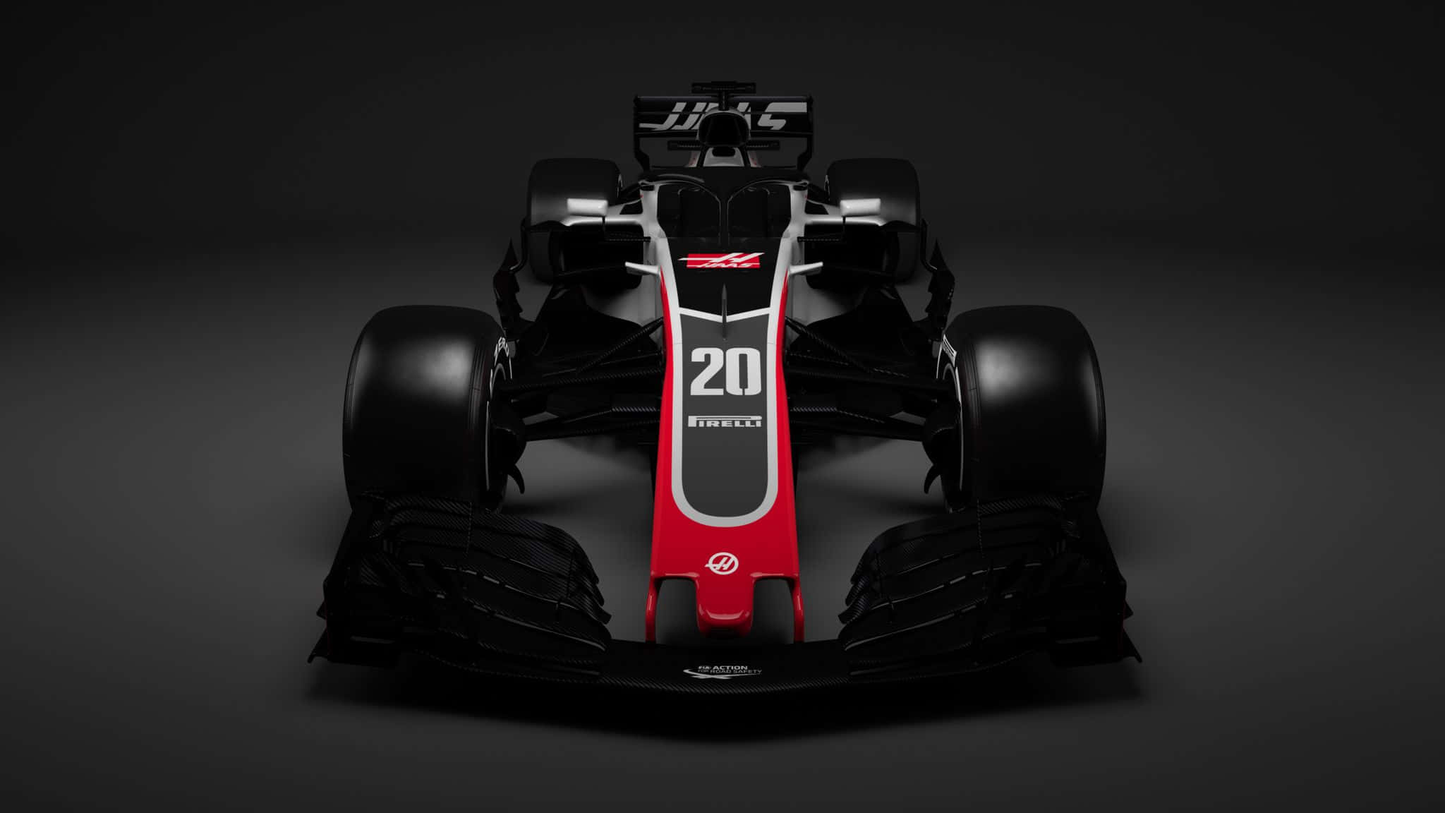 F1 2018 桌布 壁紙 — 一輛時尚的黑色和紅色一級方程式賽車，號碼20，從正面展示在深色工作室背景前。