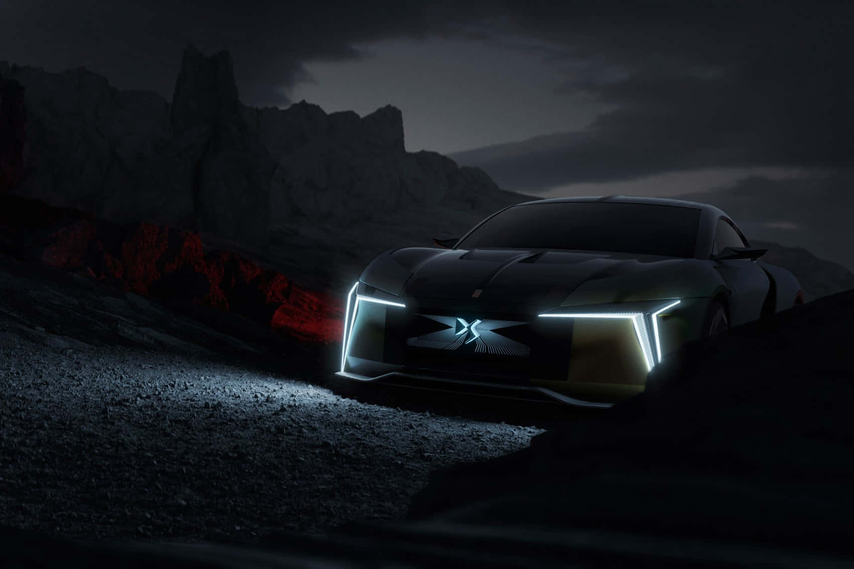 Ds Automobiles 桌布 壁紙 — 一輛時尚的黑色未來主義跑車，帶有發光的車頭燈，停在岩石地形上，背景是黑暗暴風雨的天空，附近有發光的紅色熔岩。