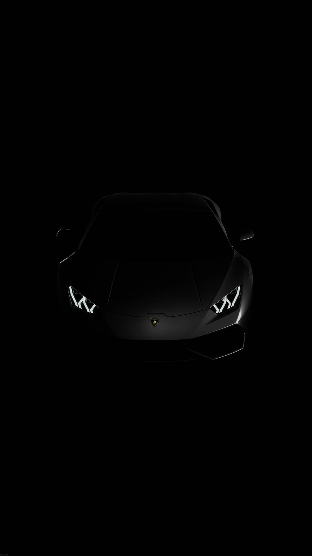 Black Lamborghini 桌布 壁紙 — 一輛時尚的黑色藍寶堅尼跑車，在漆黑的虛空中閃爍著明亮的車頭燈。