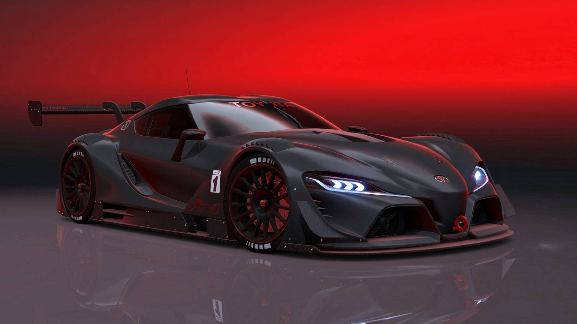 黑色賽車在紅色燈光下，反射地板上有發光的車頭燈。 — Toyota Supra Mk4 壁紙