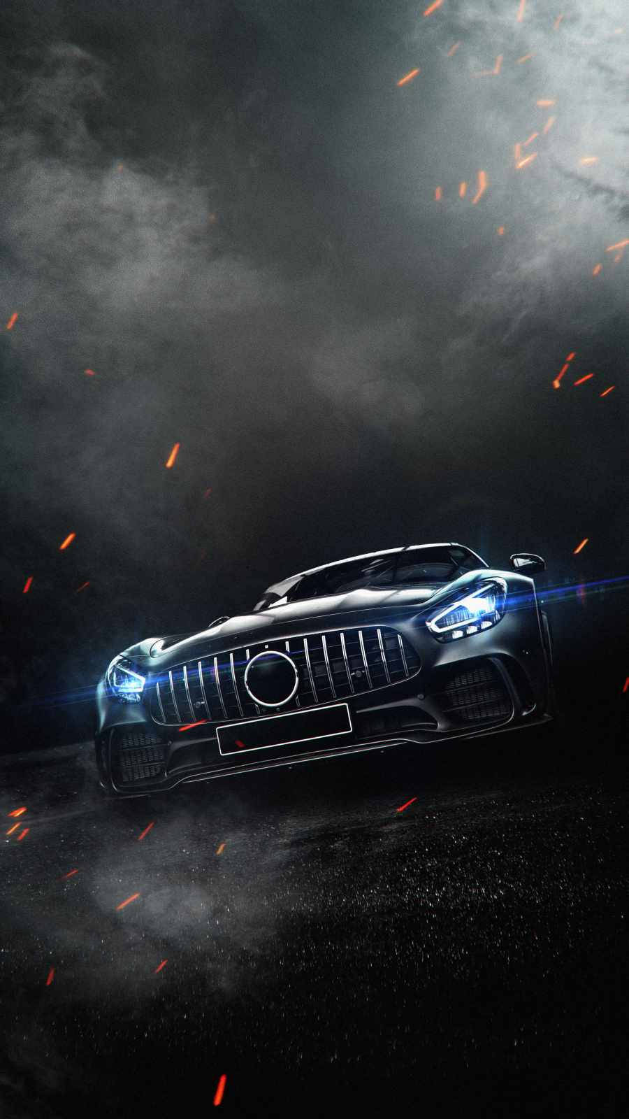 Amg 桌布 壁紙 — 一輛時尚的黑色跑車，車頭燈閃爍，在黑暗的煙霧中疾馳，伴隨著飛舞的橙色火花。