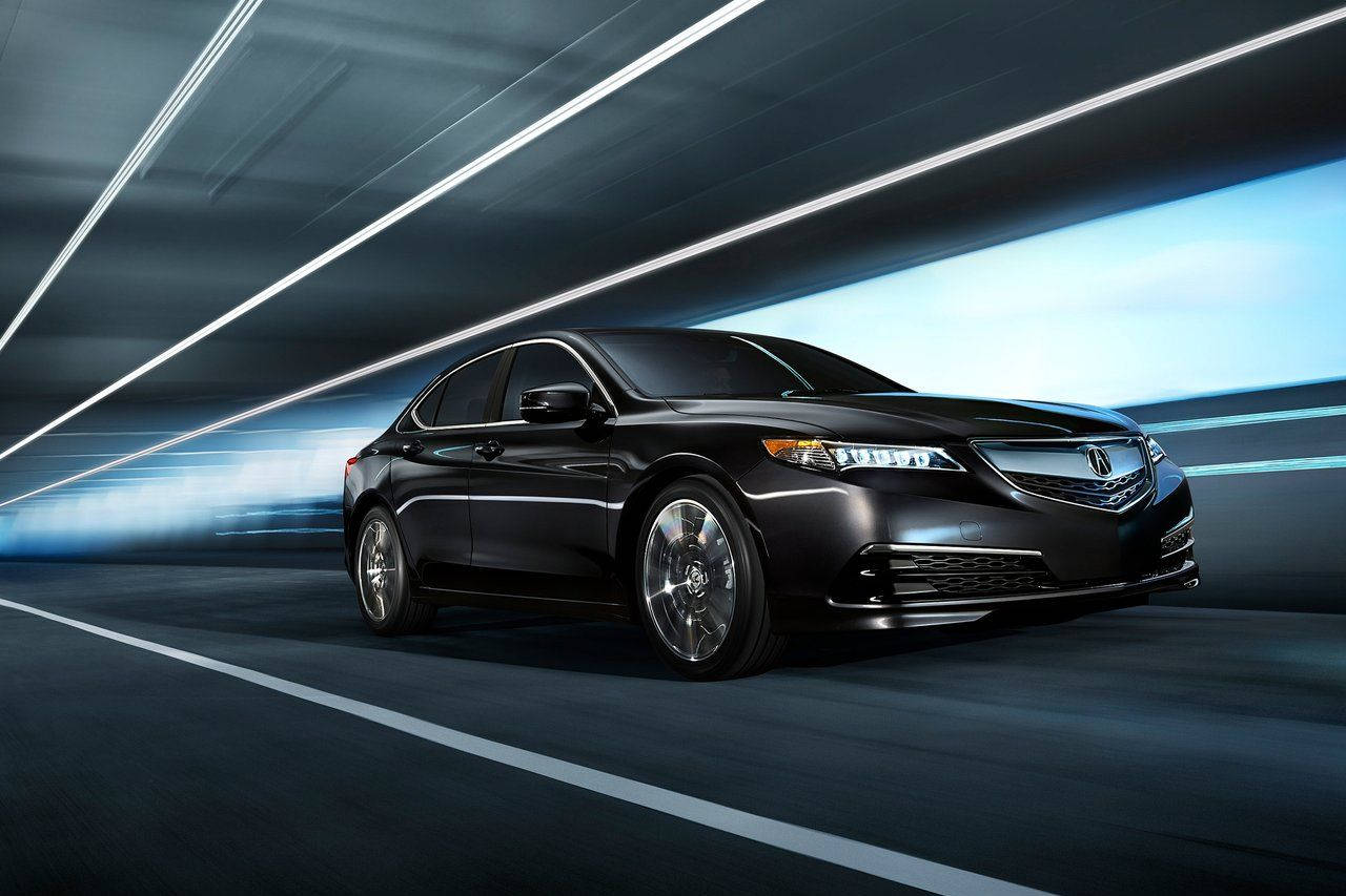 Acura 桌布 壁紙 — 一輛時尚的黑色轎車在未來主義的隧道中疾馳，帶有發光的藍色條紋和動態模糊。