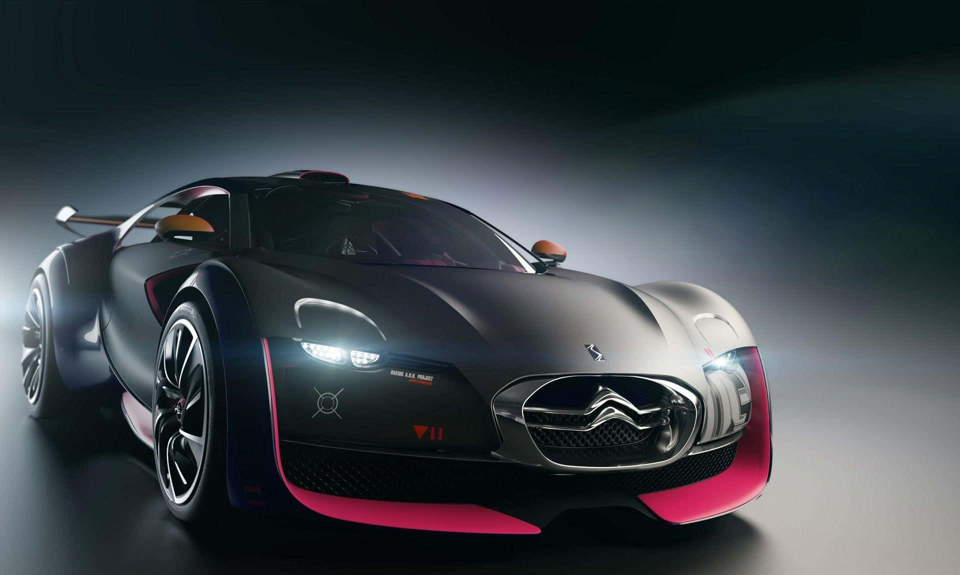 Ds Automobiles 桌布 壁紙 — 一輛時尚的黑色雪鐵龍概念車，帶有充滿活力的粉紅色點綴，在戲劇性的工作室燈光下閃耀。
