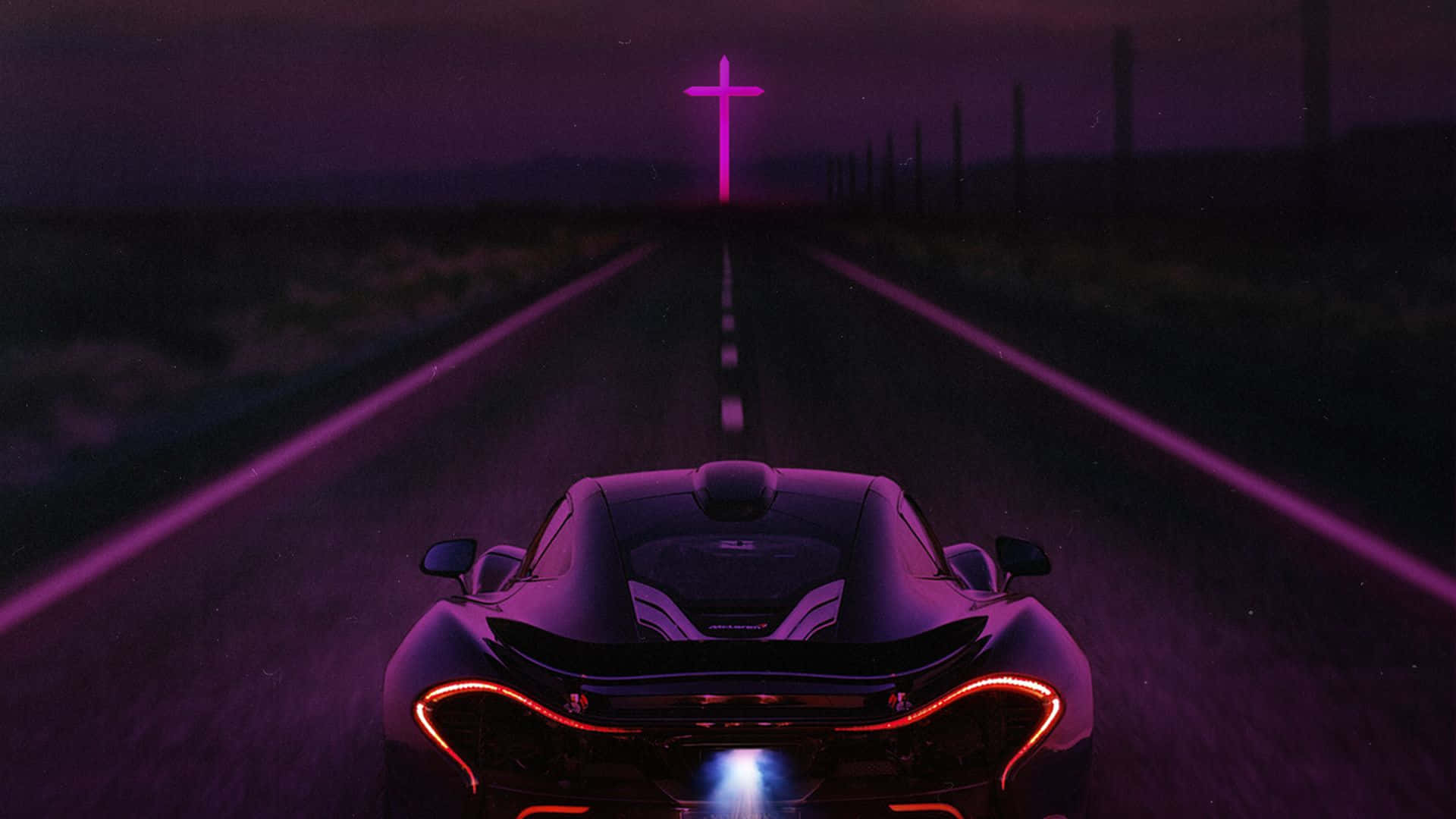 跑車在空無一人的夜路上疾馳向發光的十字架。 — 威肯 GIF 壁紙
