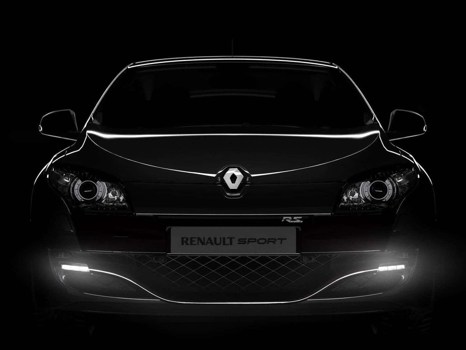 Renault Scenic 桌布 壁紙 — 一輛時尚黑色雷諾運動車的前視圖，在黑暗背景下被發光的車頭燈照亮。