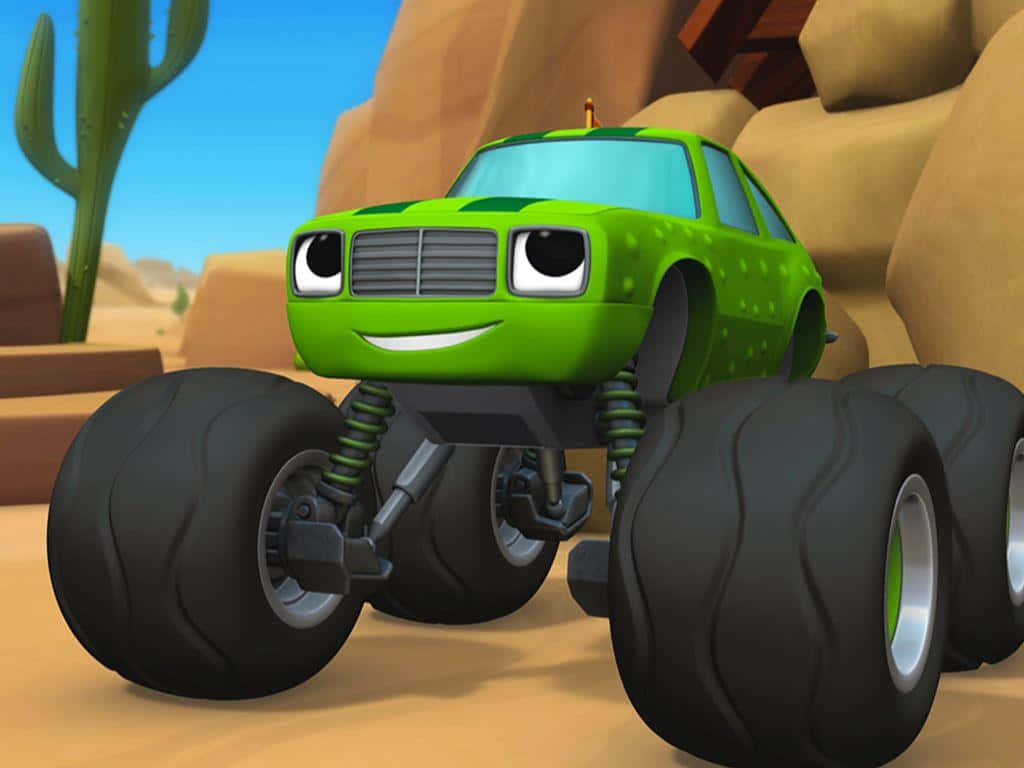 Blaze And The Monster Machines 桌布 壁紙 — 一輛有大眼睛和笑容的綠色開心怪獸卡車，在陽光明媚的沙漠中行駛，周圍有仙人掌和岩石 formations。