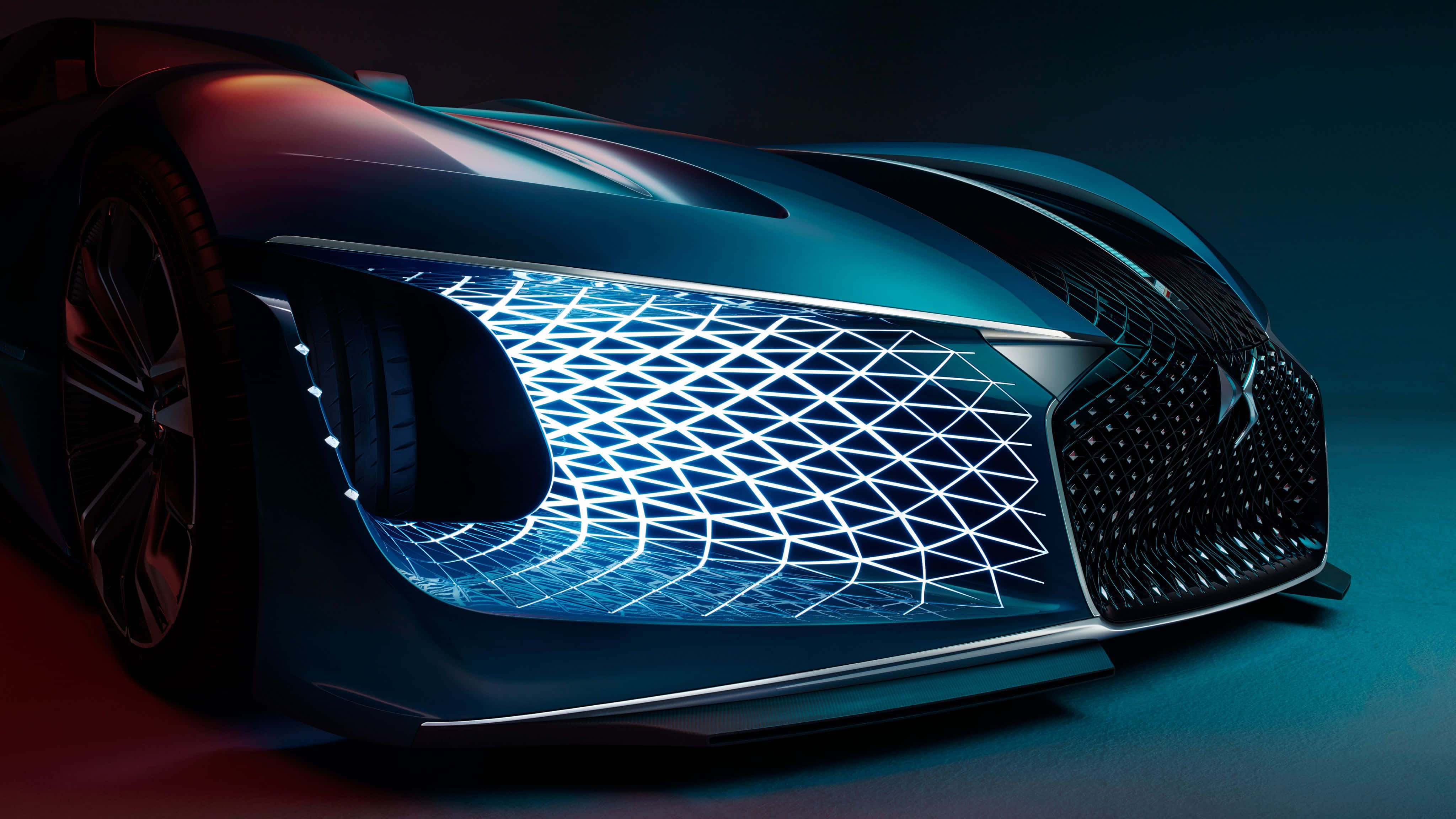 Ds Automobiles 桌布 壁紙 — 一輛未來主義的跑車在戲劇性的工作室燈光下發出藍色霓虹燈光。