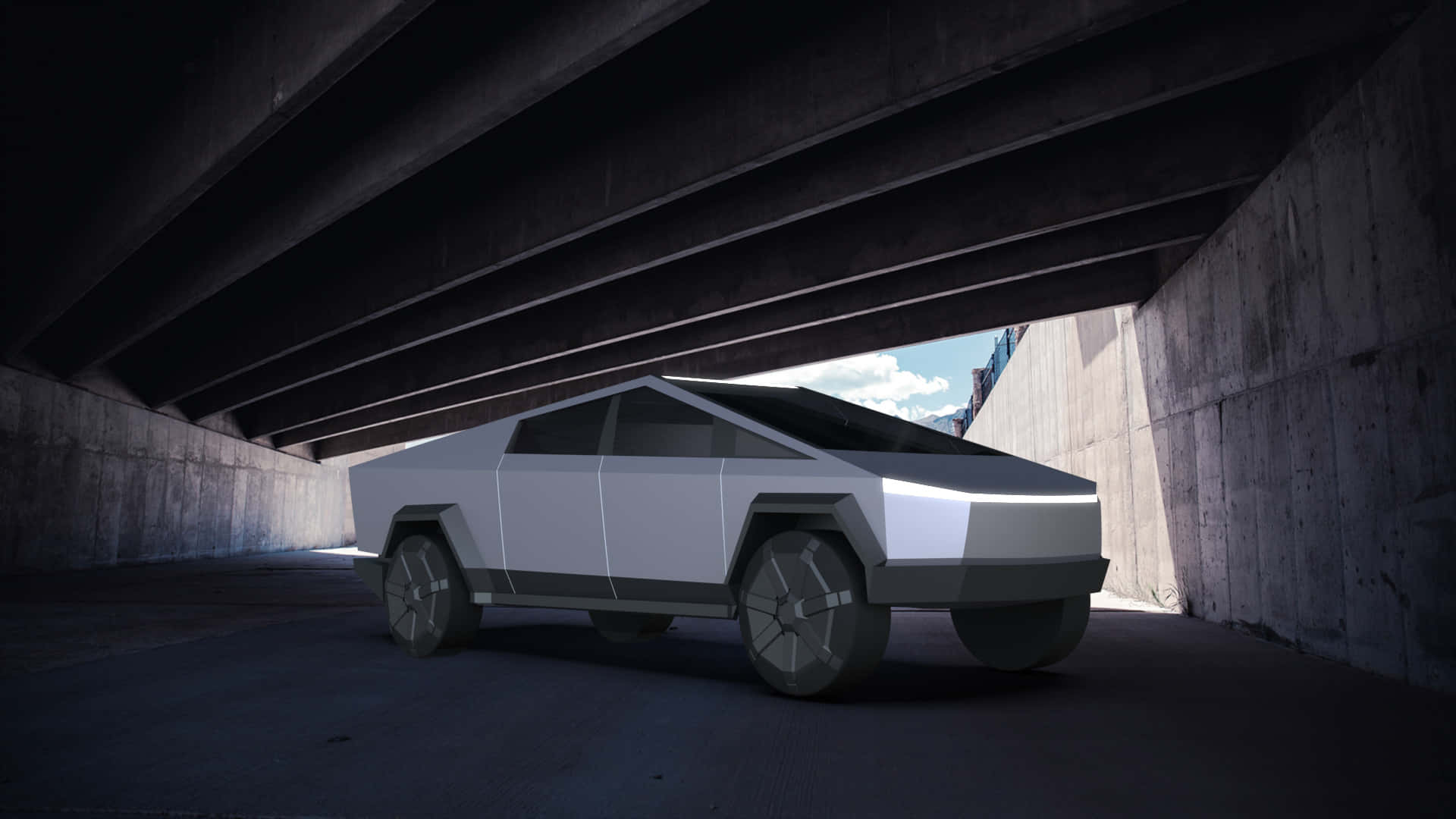 Tesla Cybertruck 桌布 壁紙 — 一輛未來感十足的銀色 Tesla Cybertruck 停放在混凝土天橋下，陽光從上方灑落。