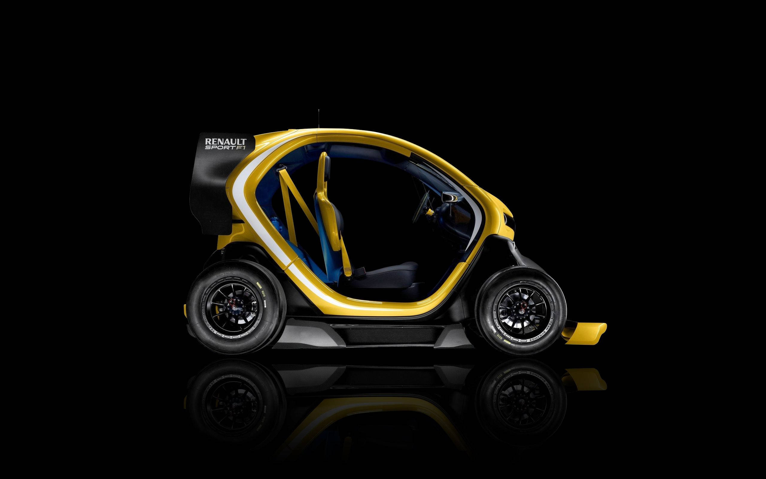 Renault 桌布 壁紙 — 一輛流線型的黃黑 Renault Sport 11 概念車，車門打開，在攝影棚燈光下立於反光黑色表面。