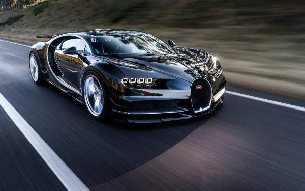 黑色Bugatti Chiron在道路上高速行駛，帶動態模糊效果。 — 4K 壁紙