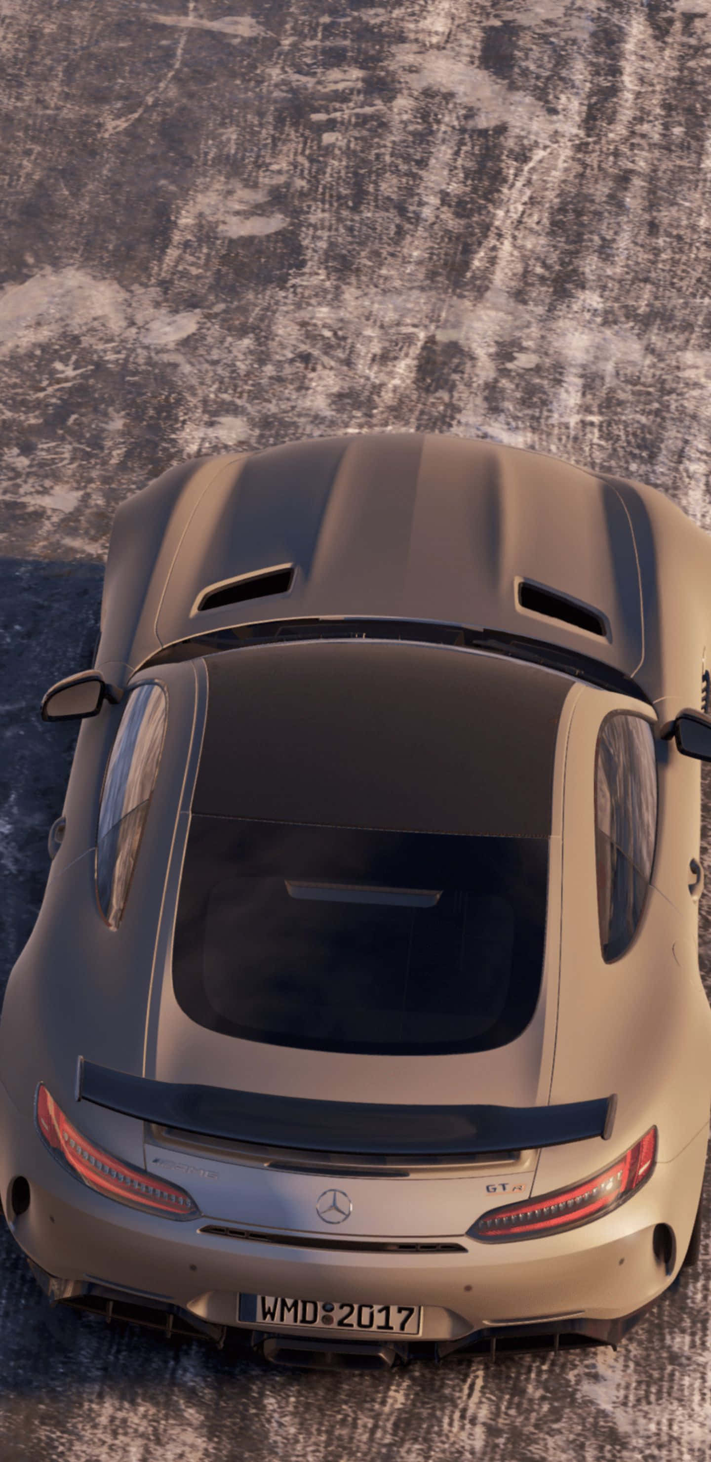 Pixel 3xl Project Cars 2 桌布 壁紙 — 一輛消光灰色的梅賽德斯-AMG GT R 跑車從上方俯視，位於裂縫的瀝青路面上，沐浴在溫暖的陽光下。
