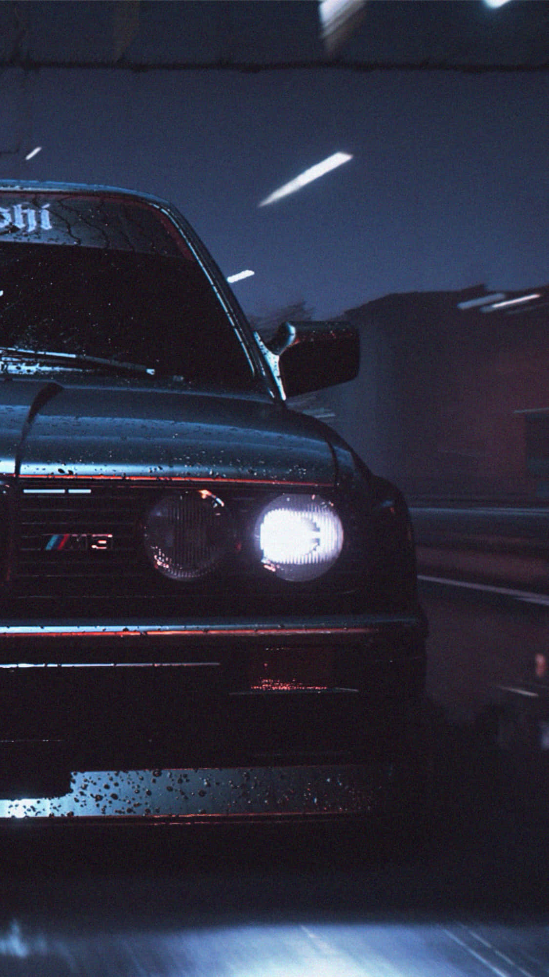 電玩遊戲 桌布 壁紙 — 一輛濕透的黑色BMW M3在夜間飛馳穿過被雨水浸濕的隧道，明亮的車頭燈劃破霧氣。