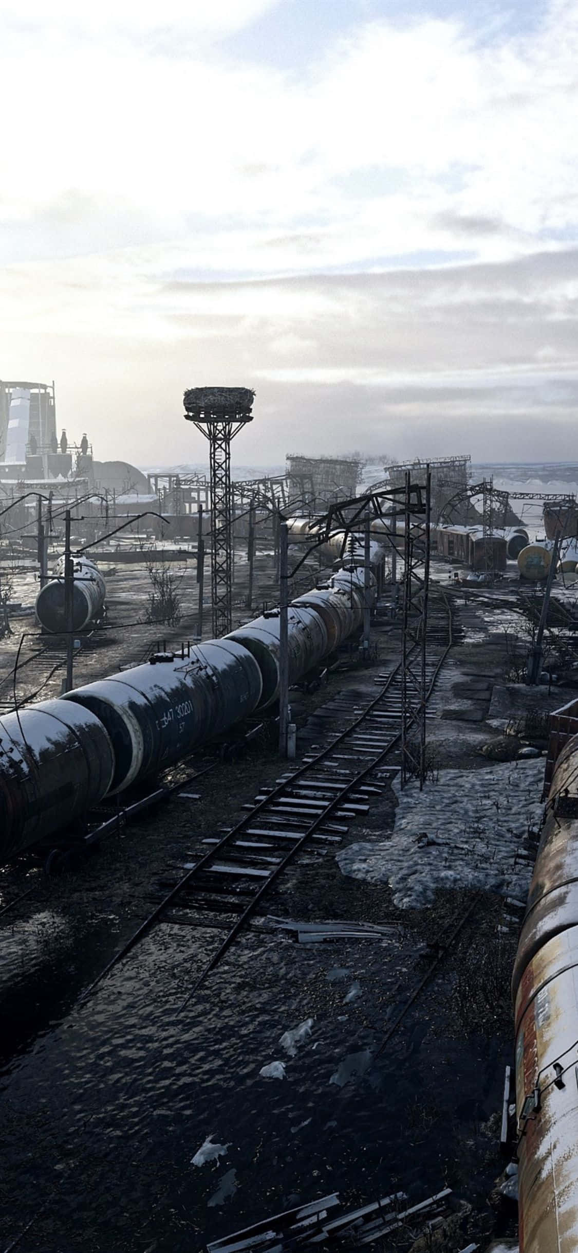 iPhone X Metro Exodus 桌布 壁紙 — 一輛生鏽的火車車廂停在破損的軌道上，位於陰天下荒涼的工業廢墟中。