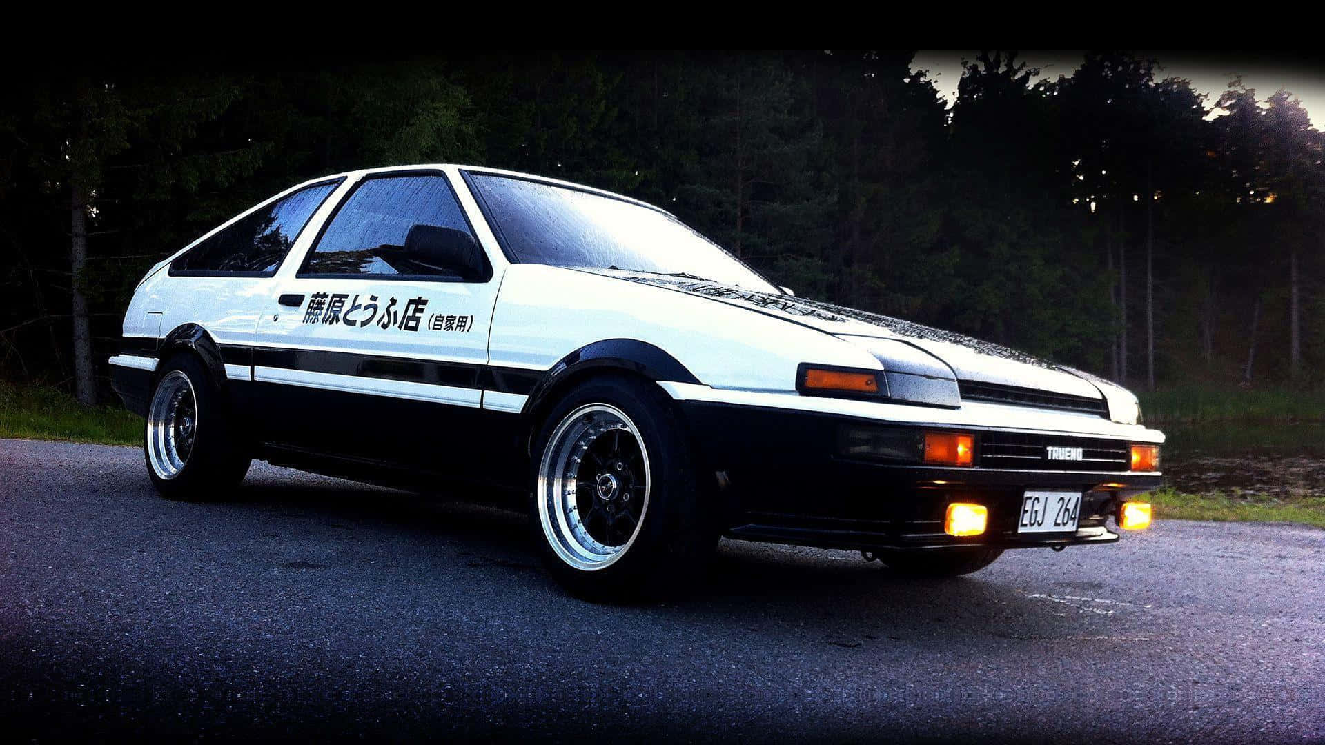 白色和黑色的AE86跑車，帶有日文字，停泊在黃昏時分的道路上。 — Toyota Supra Mk4 壁紙