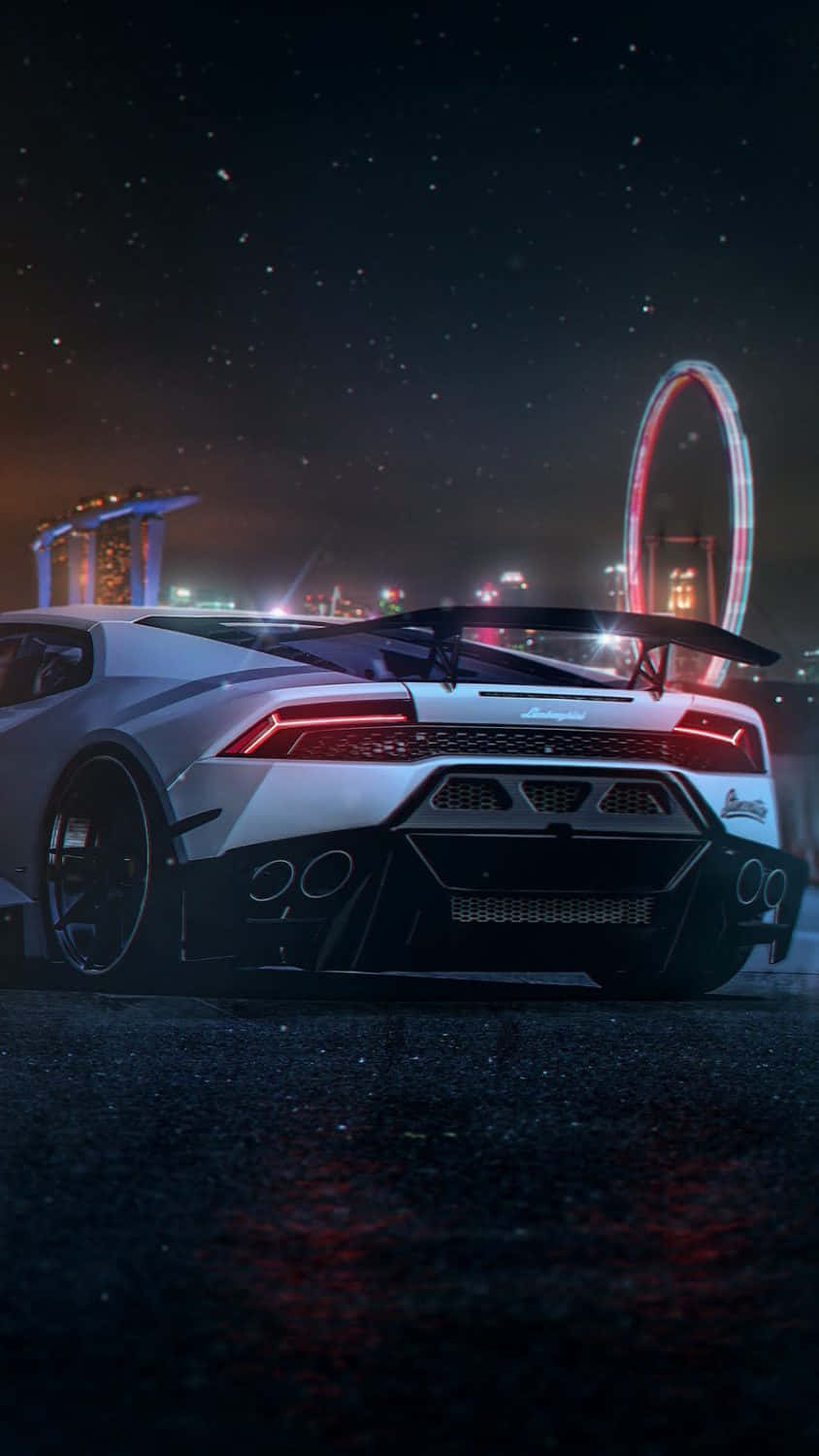 Pixel 3xl Lamborghini 桌布 壁紙 — 一輛白色藍寶堅尼跑車在星空下閃耀，背景是城市燈光和發光的摩天輪。