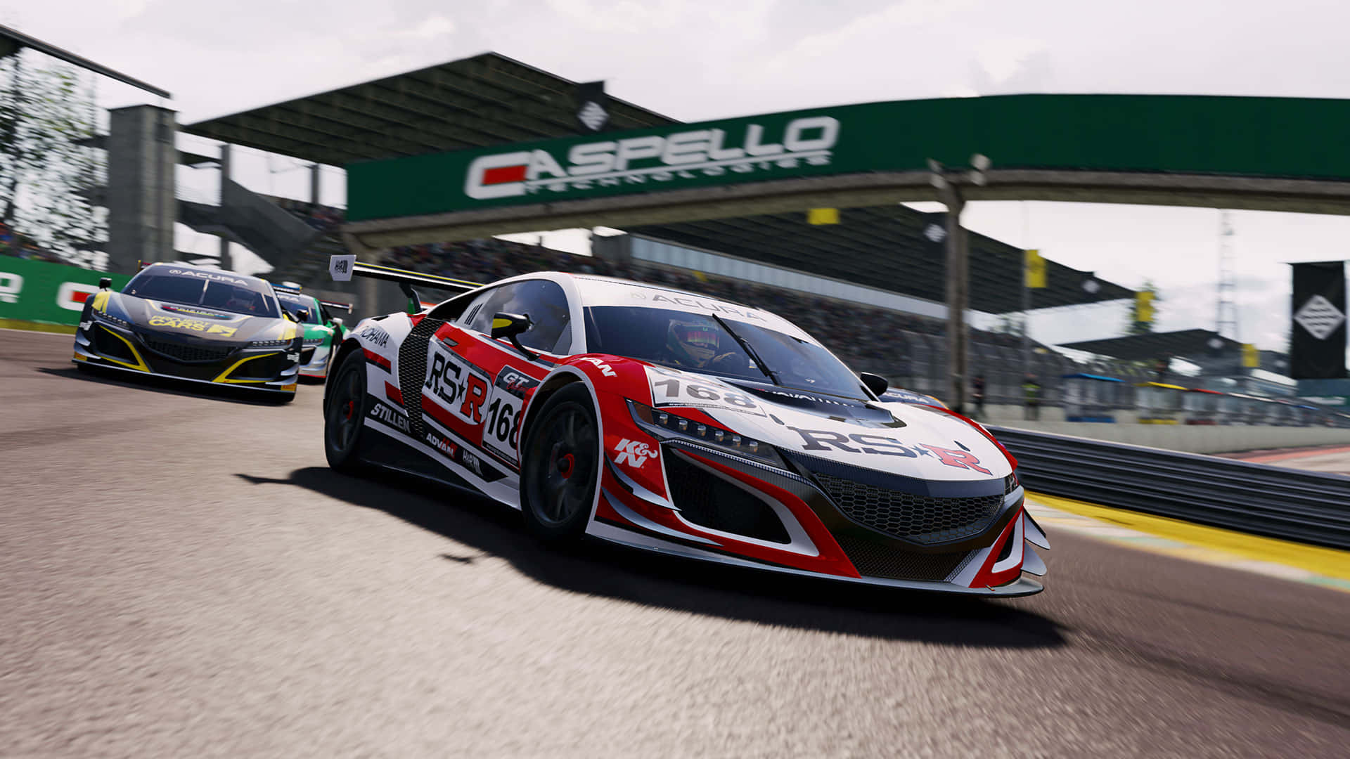 1920x1080 Project Cars 桌布 壁紙 — 一輛紅白賽車在綠色的「Caspello Technologies」拱門下高速繞圈，後面還有另一輛車跟隨。