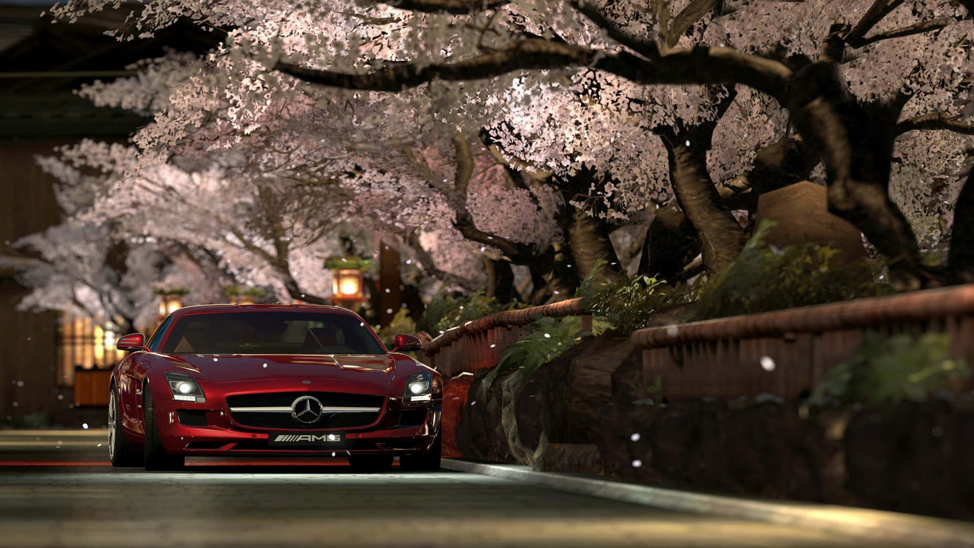 1920 X 1080 Car 桌布 壁紙 — 一輛紅色 Mercedes-AMG 跑車在夜晚的日本寧靜街道場景中，在發光的櫻花樹下滑行。