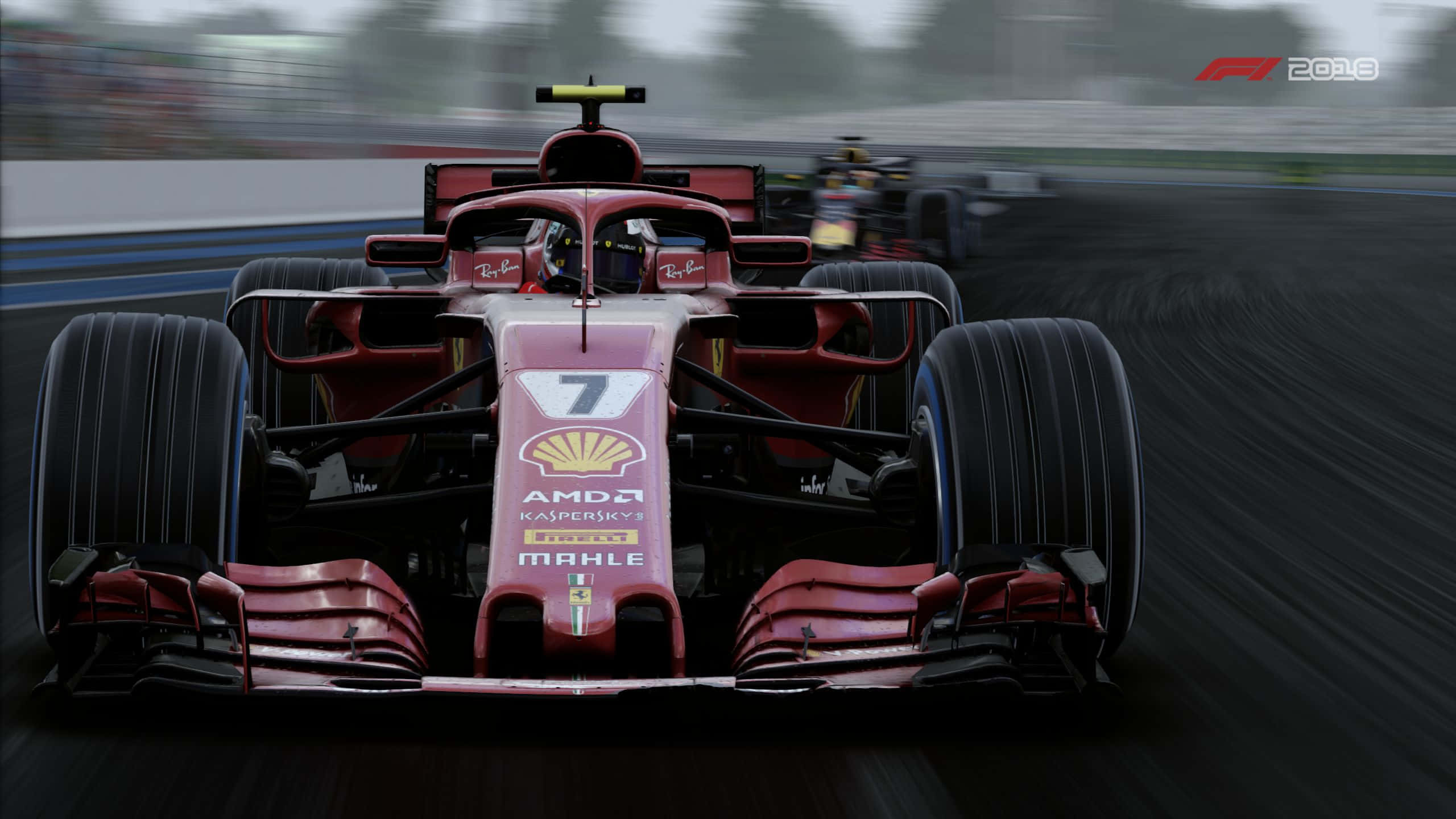 Formula One 桌布 壁紙 — 一輛紅色一級方程式賽車，編號7，在濕滑賽道上奔馳，帶有動態模糊效果，後面可見另一輛賽車。
