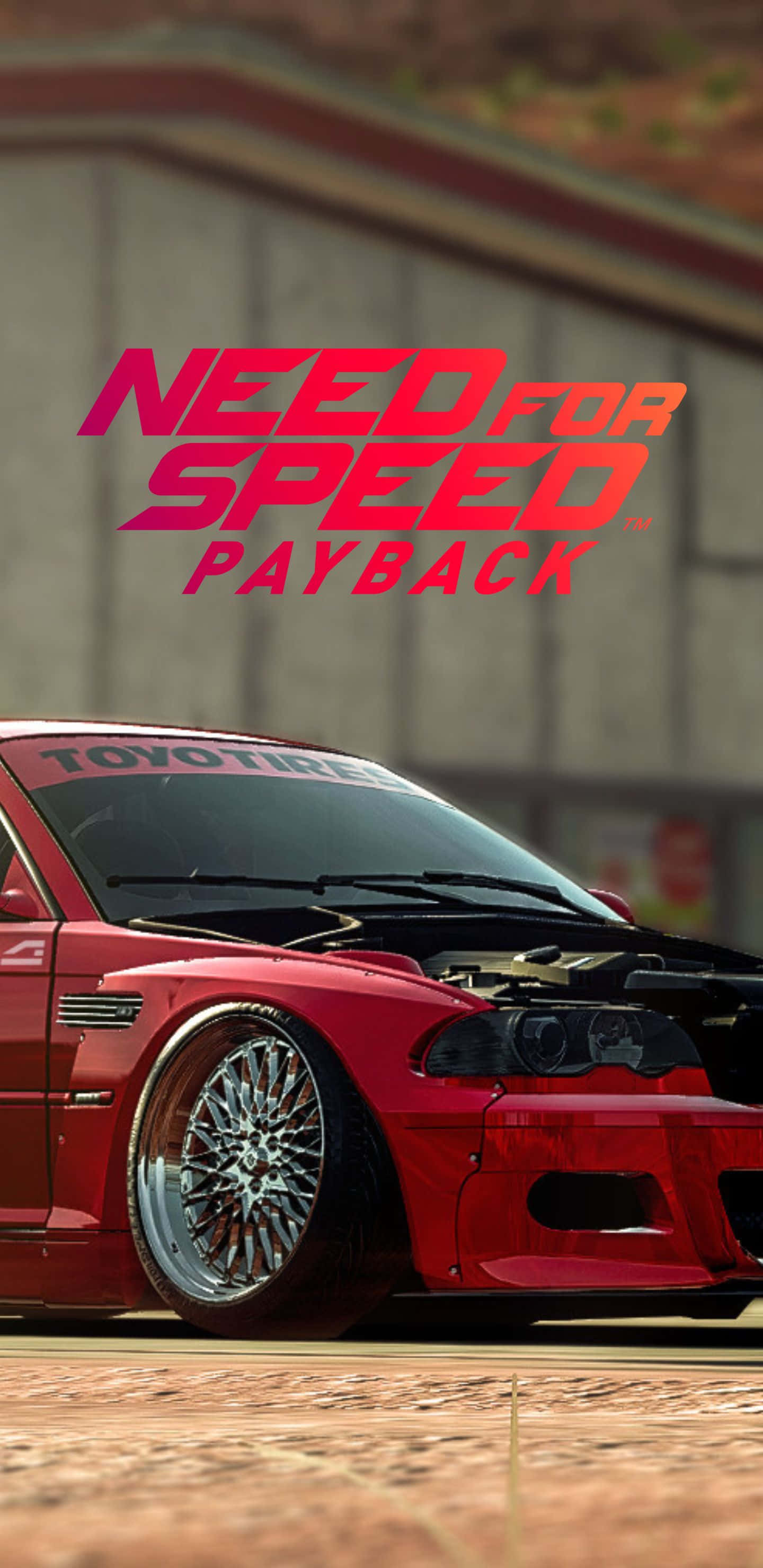 Pixel 3xl Need For Speed Payback 桌布 壁紙 — 一輛紅色改裝跑車，引擎蓋打開，配備訂製輪圈，停在帶有『Need for Speed Payback』標誌的建築物前。