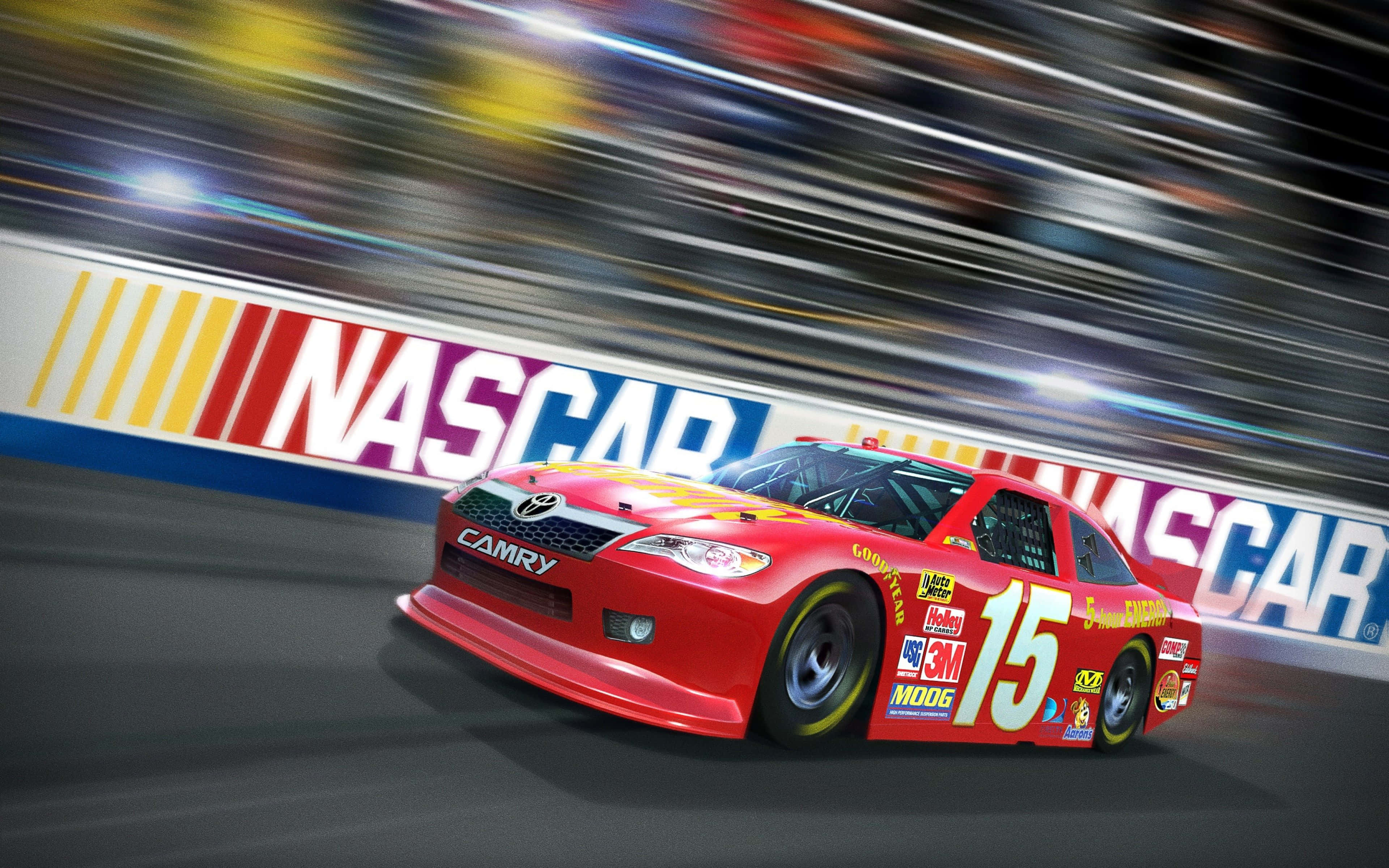 美國 桌布 壁紙 — 一輛紅色的NASCAR豐田Camry賽車高速駛過模糊的人群和賽道牆，動態模糊強調了高速。