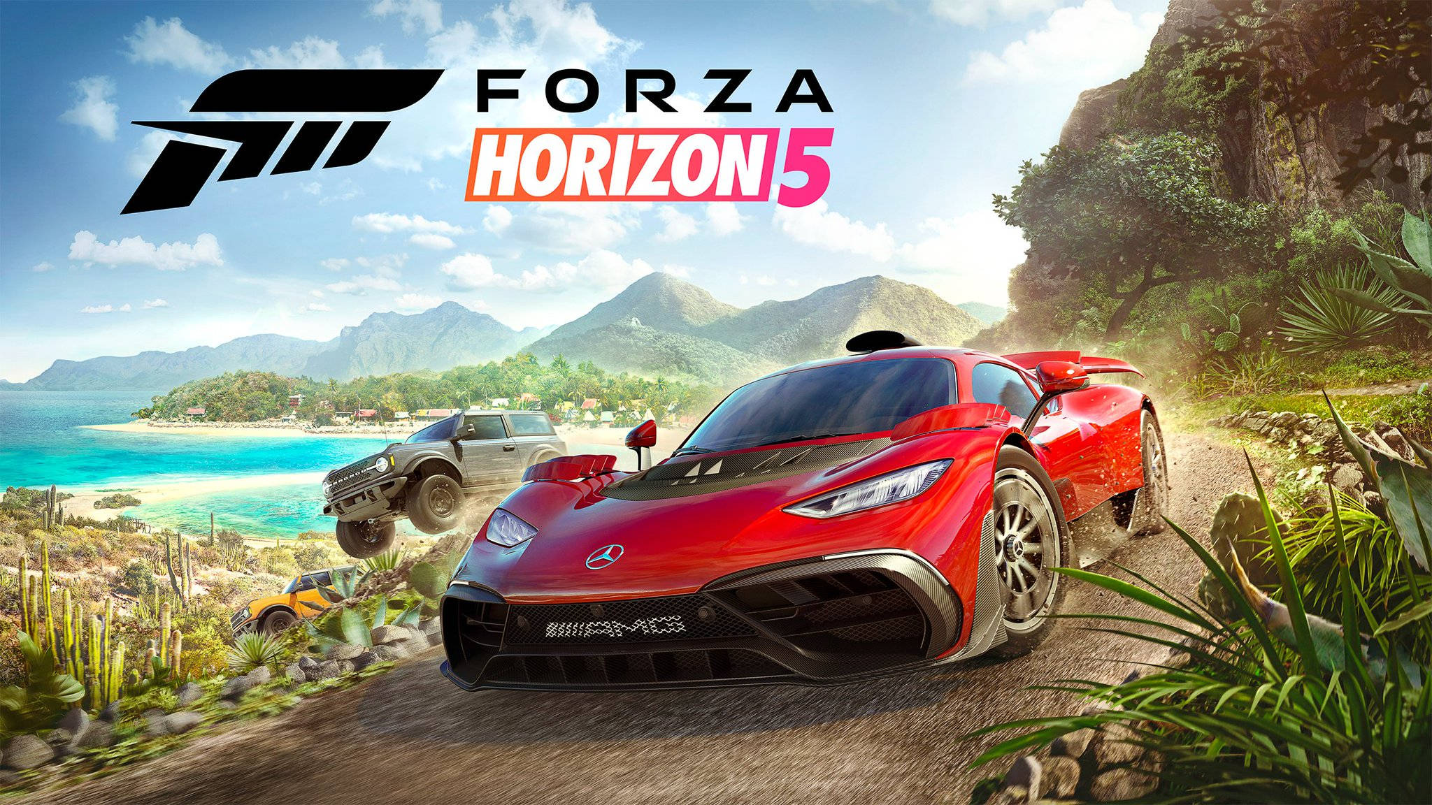 Forza Gaming 桌布 壁紙 — 一輛紅色跑車在充滿活力的《極限競速：地平線5》場景中，沿著一條塵土飛揚的山路，在碧綠海灘旁與其他車輛一起飛馳。