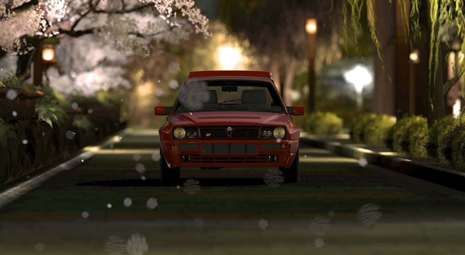 Lancia 桌布 壁紙 — 一輛紅色跑車在夜晚行駛在櫻花樹成蔭的街道上，花瓣飄落，路燈溫暖。