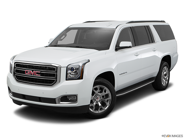 GMC 桌布 壁紙 — 一輛純白色的GMC Yukon XL SUV在攝影棚中展示，線條簡潔，帶有鍍鉻裝飾。