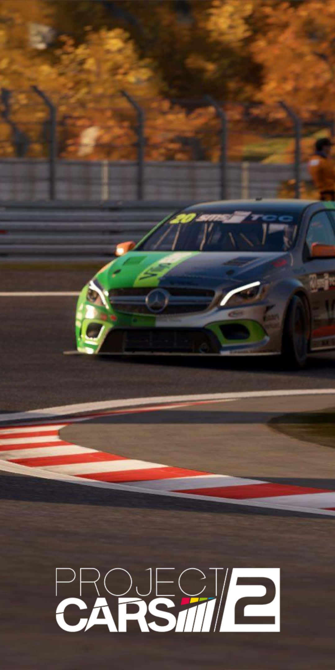 Pixel 3 Project Cars 2 桌布 壁紙 — 一輛綠色和黑色的賽車在賽道彎道高速行駛，籬笆後面的秋樹在溫暖的光線中閃耀。