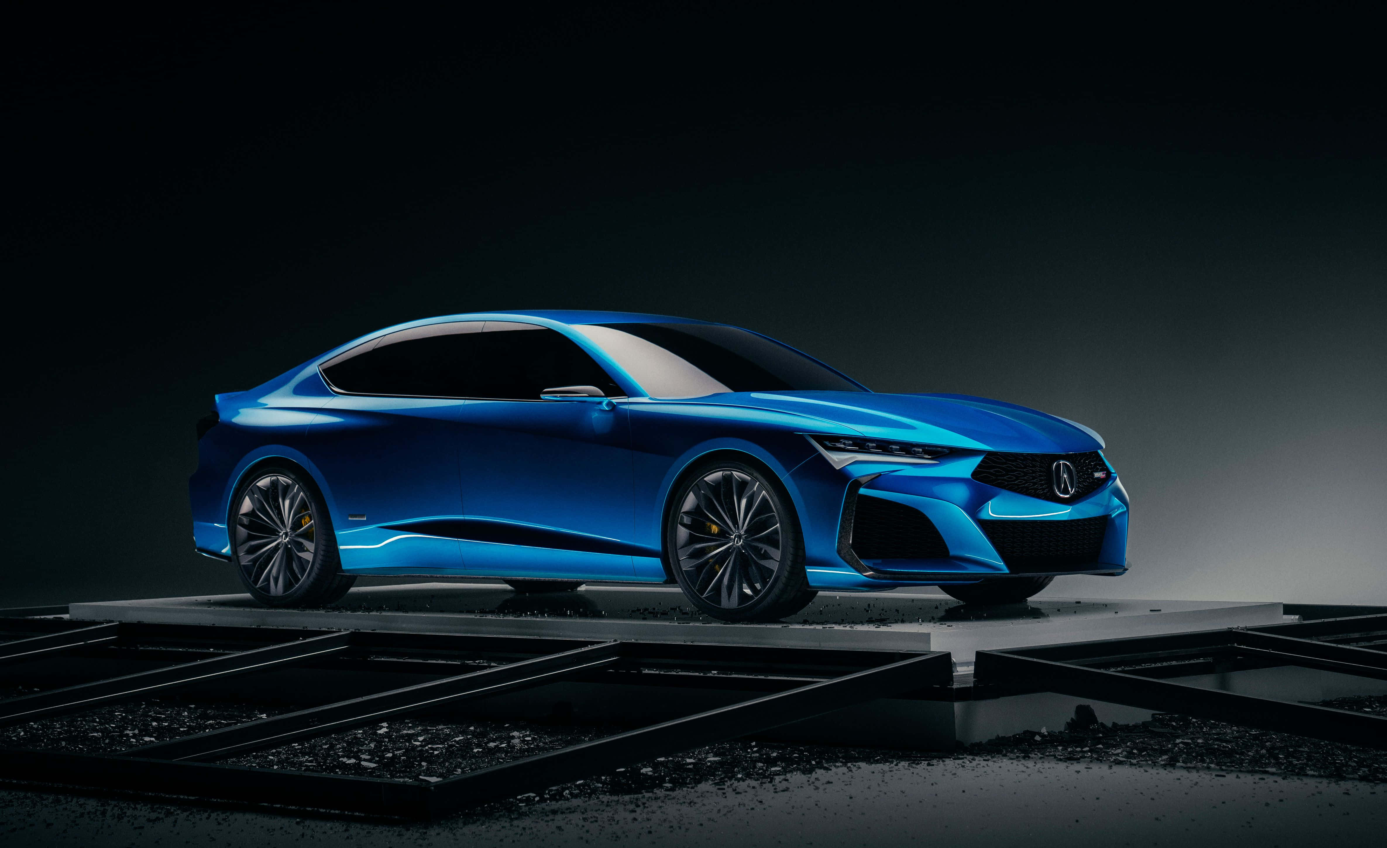 Acura 桌布 壁紙 — 一輛線條銳利、帶有發光裝飾的時尚藍色跑車，在黑暗的攝影棚背景下被戲劇性地照亮。