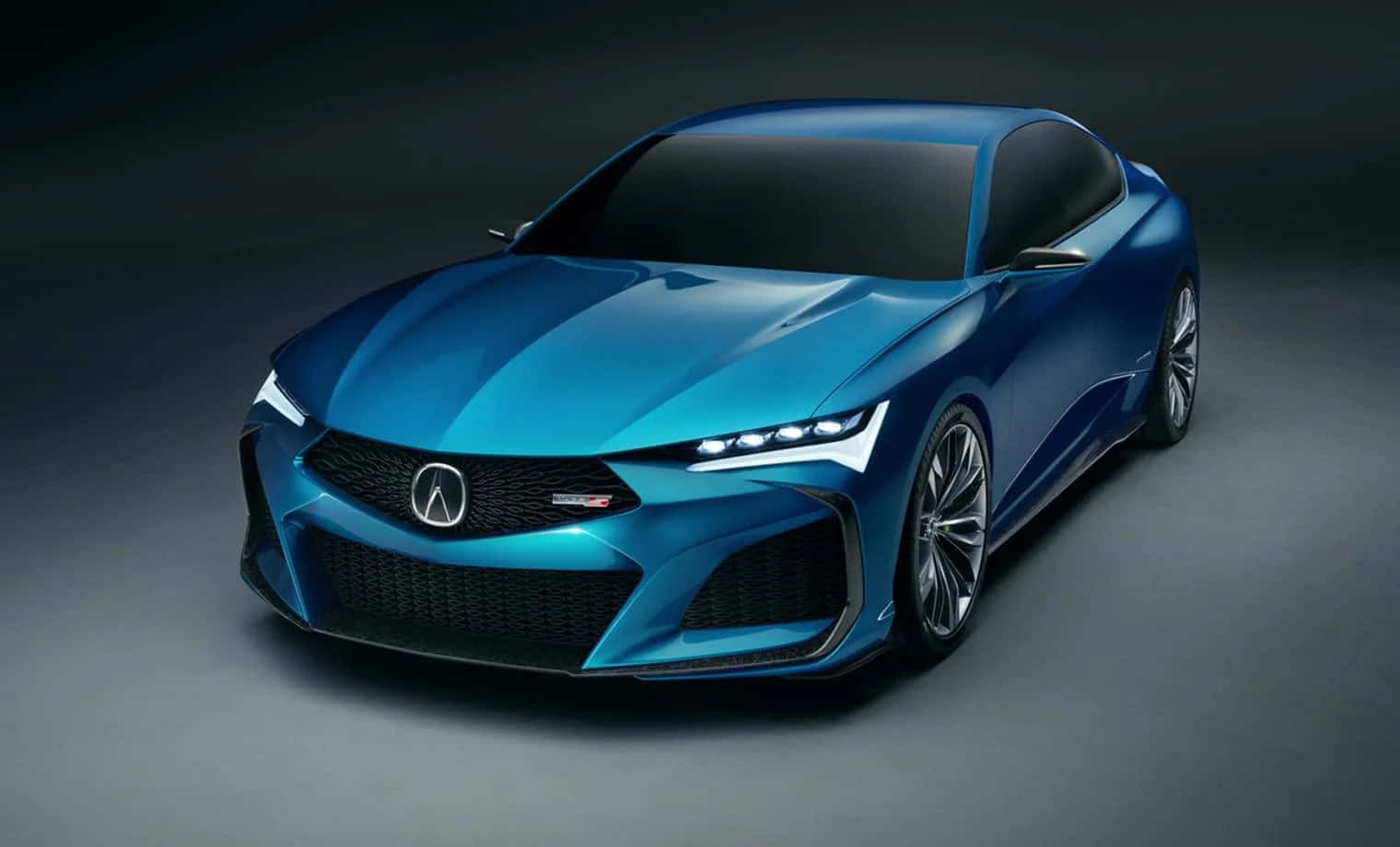 Acura 桌布 壁紙 — 一輛線條銳利、車頭燈發光的時尚藍色跑車，在黑暗的攝影棚背景下展示。