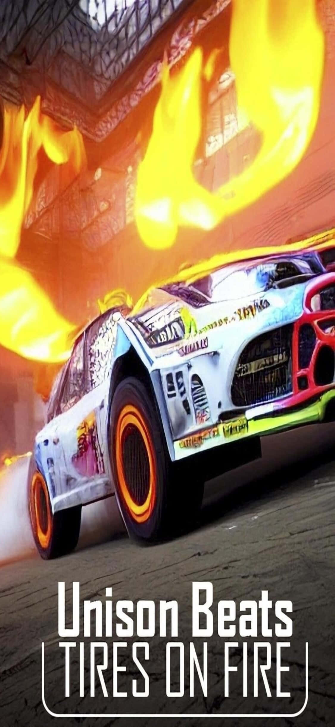 iPhone Xs Dirt Showdown 桌布 壁紙 — 一輛色彩鮮豔的拉力賽車帶著火焰輪胎，高速穿梭於城市隧道中。