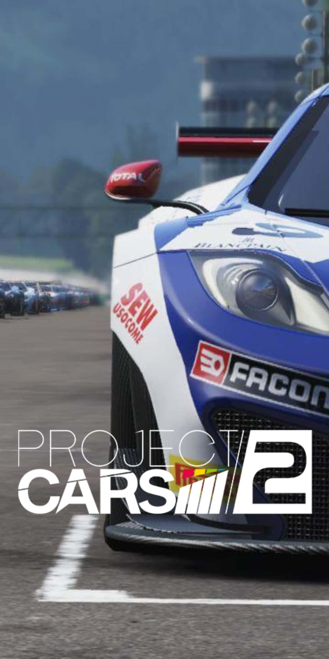 Pixel 3 Project Cars 2 桌布 壁紙 — 一輛藍白賽車帶有贊助商標誌，停在賽道上，背景有其他賽車。