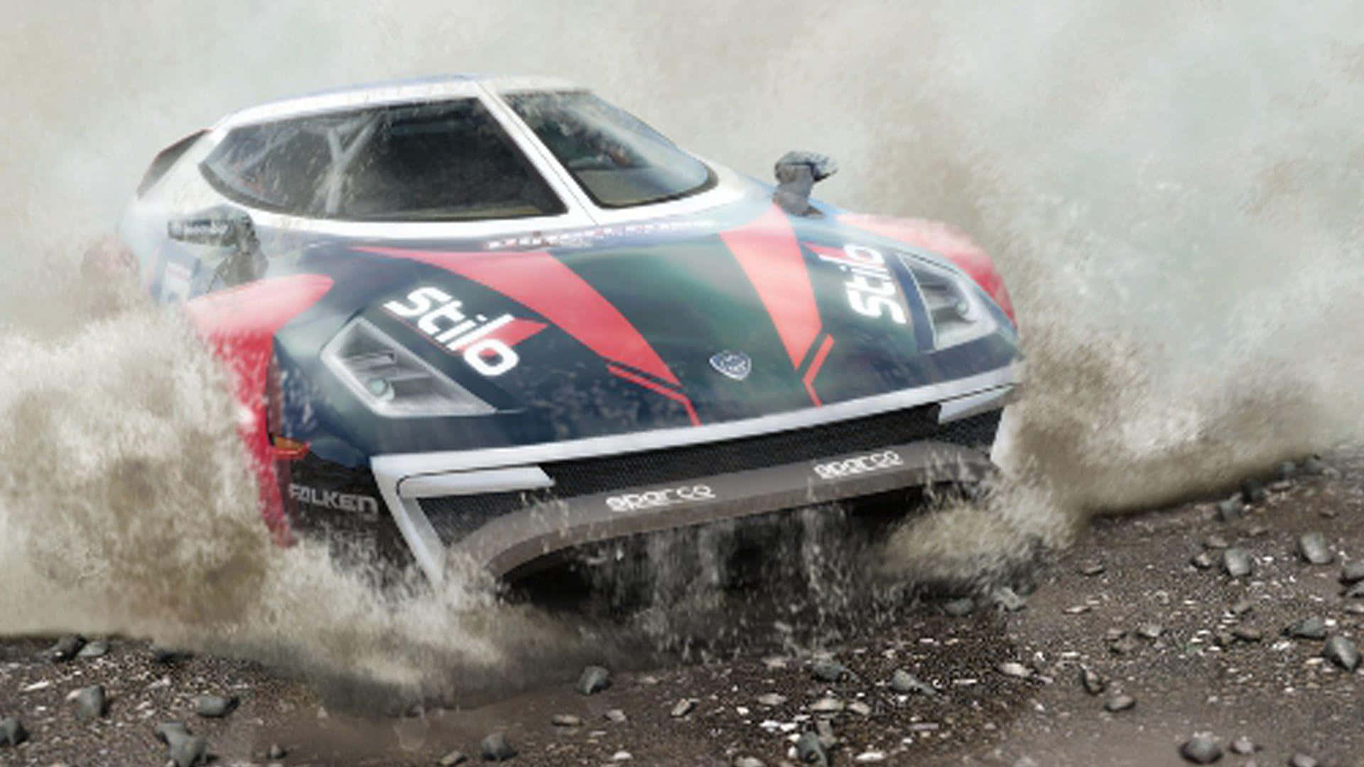 Dirt 3 桌布 壁紙 — 一輛藍紅色的拉力賽車在泥濘地形中飛馳，車輪周圍水花四濺。