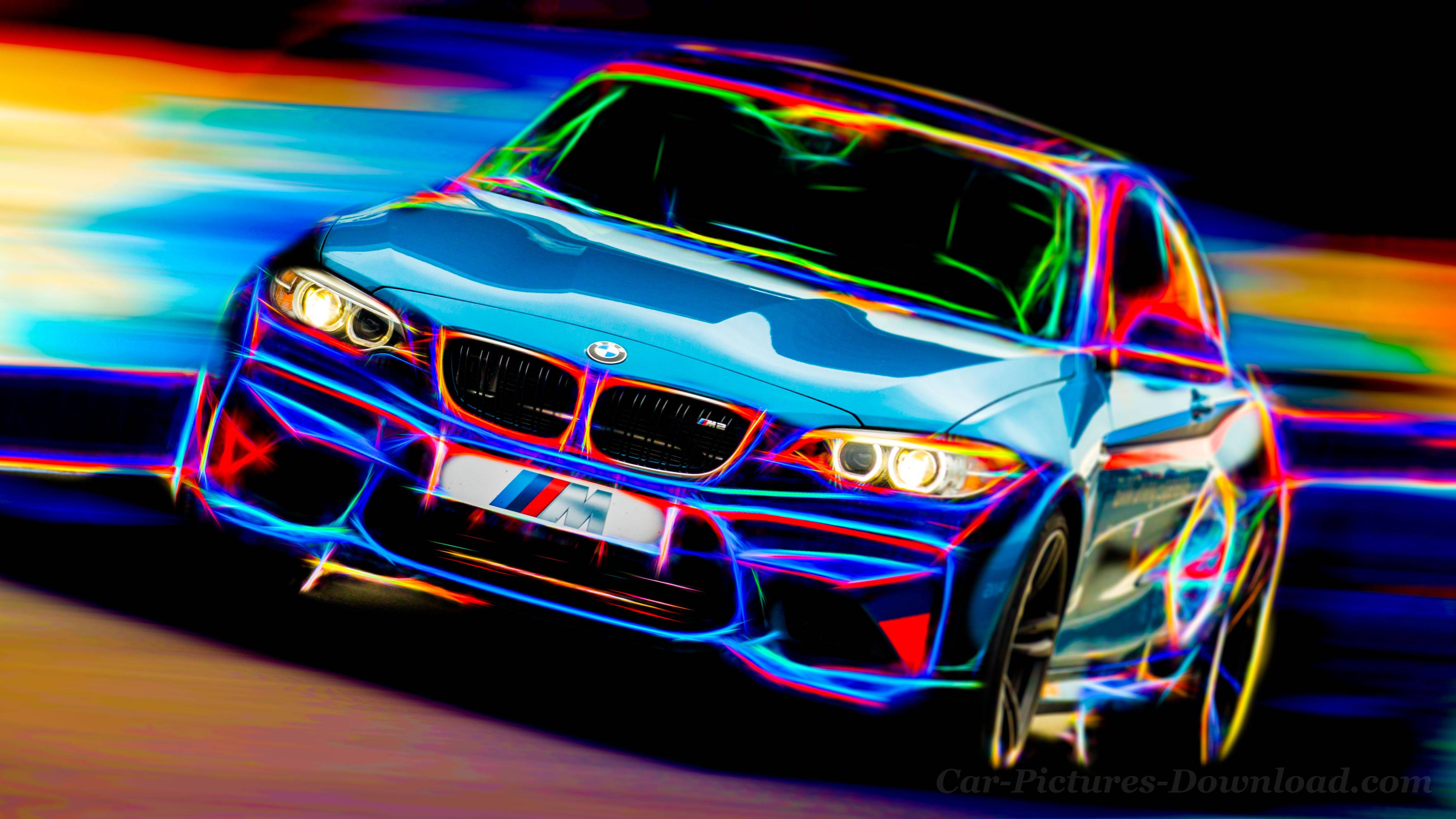 桌布 壁紙 — 一輛藍色BMW跑車在黑暗背景中向前飛馳，留下霓虹燈光軌跡。