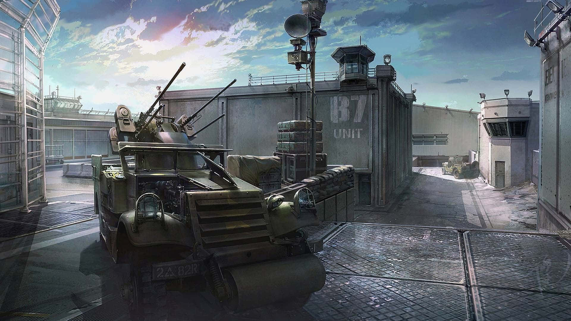 桌布 壁紙 — 一輛配備機槍的軍用裝甲車停在一個粗糙的工業園區，背景是戲劇性的黃昏天空。