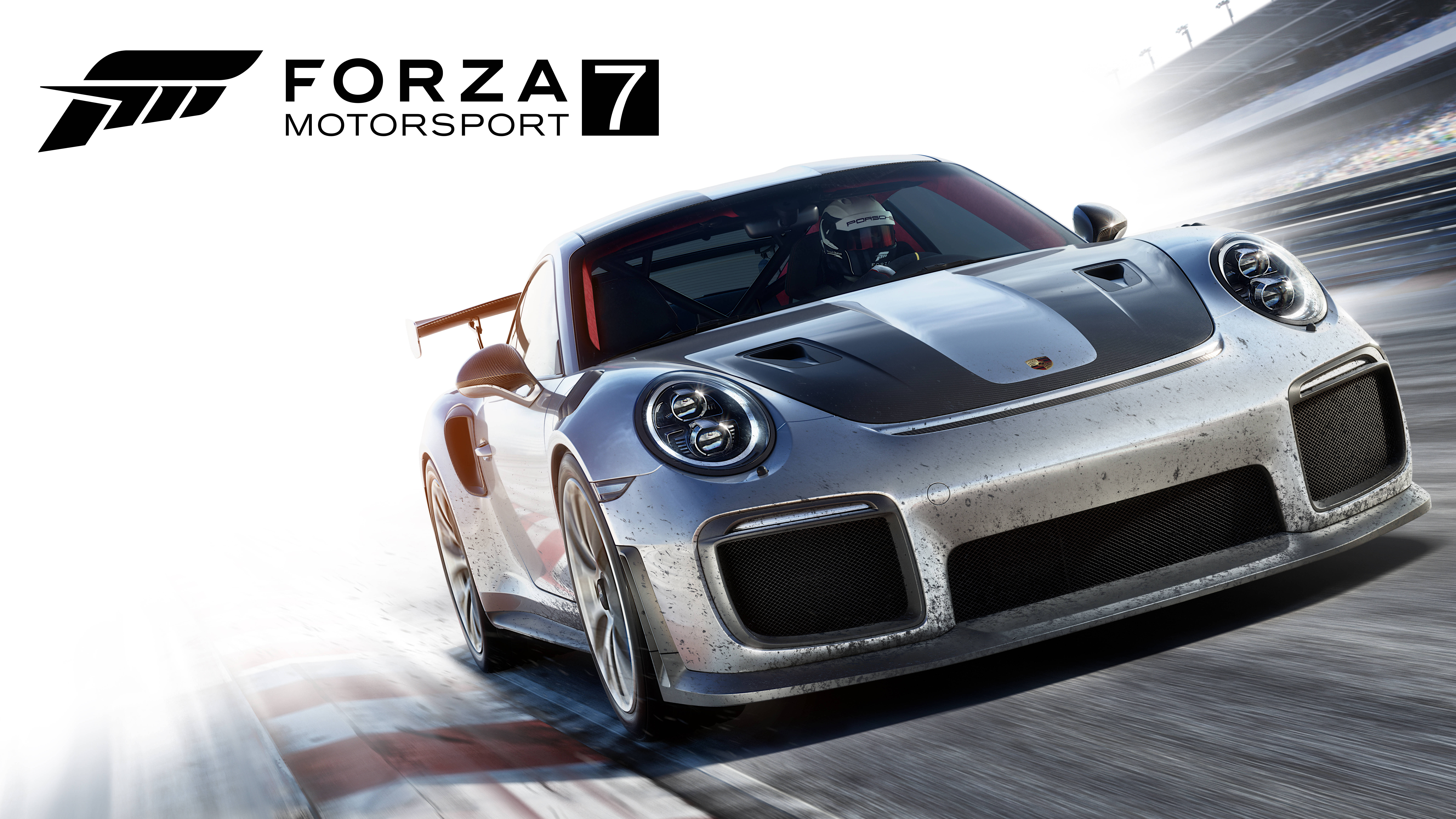 Motorsport 桌布 壁紙 — 一輛銀色保時捷911 GT1賽車在賽道上疾馳，帶有動態模糊和明亮的陽光。