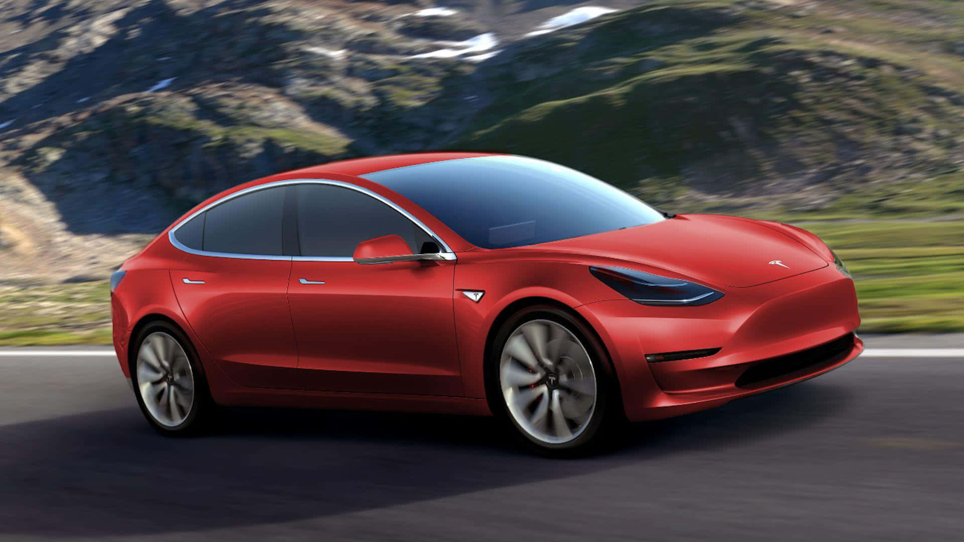 Tesla Model 3 桌布 壁紙 — 一輛鮮紅色的Tesla Model 3沿著山路行駛，背景是白雪覆蓋的山峰和茂密的綠植。