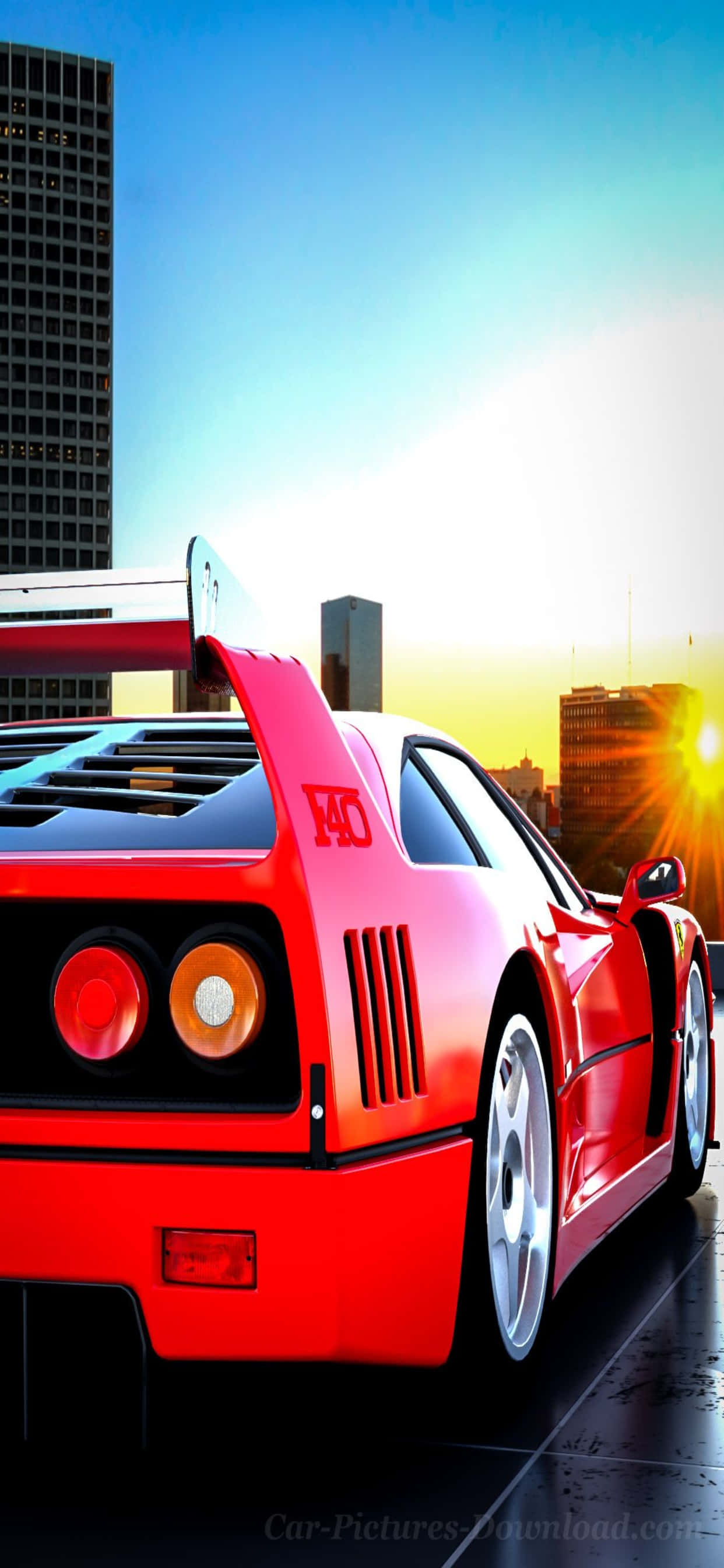 Red Car 桌布 壁紙 — 一輛鮮紅色的法拉利F40跑車在日落時分濕漉漉的城市街道上閃閃發光，背景是高樓大廈。