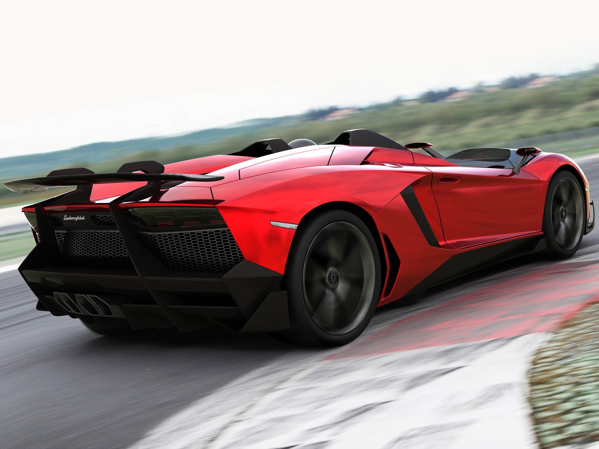 4K 藍寶堅尼 桌布 壁紙 — 一輛鮮紅色的藍寶堅尼 Aventador Roadster 在蜿蜒的賽道上疾馳，背景是模糊的動感和綠色的山丘。