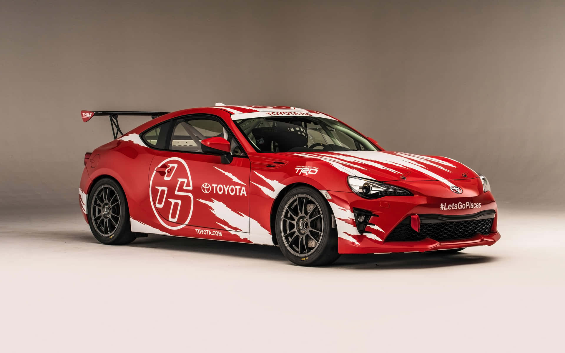 紅色豐田跑車在攝影棚內帶白色賽車塗裝 — Toyota Supra Mk4 壁紙