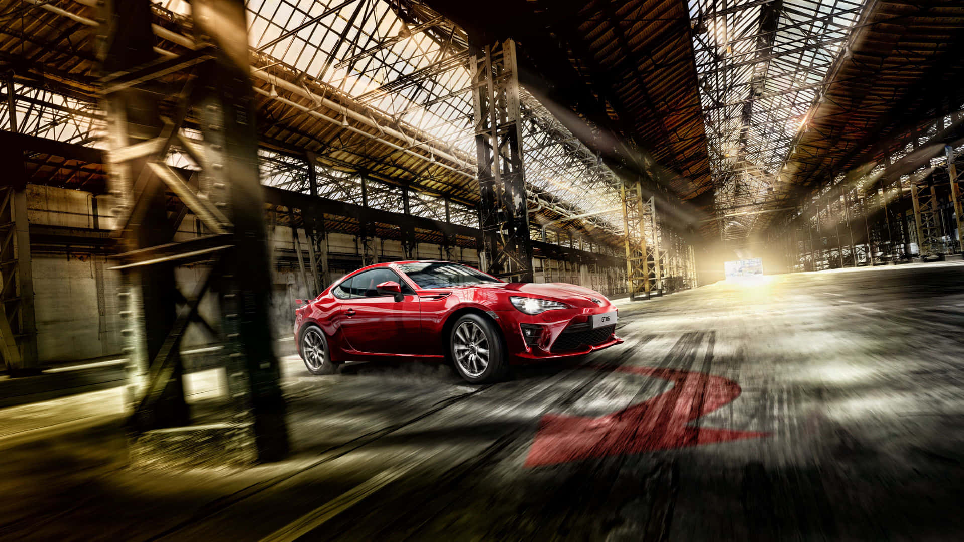 紅色跑車在日落時分穿過工業倉庫。 — Toyota Supra Mk4 壁紙