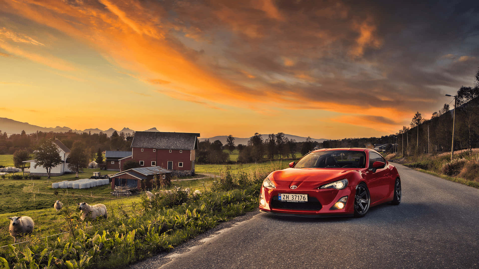 鄉村道路上的紅色跑車，有羊和穀倉，金色日落。 — Toyota Supra Mk4 壁紙