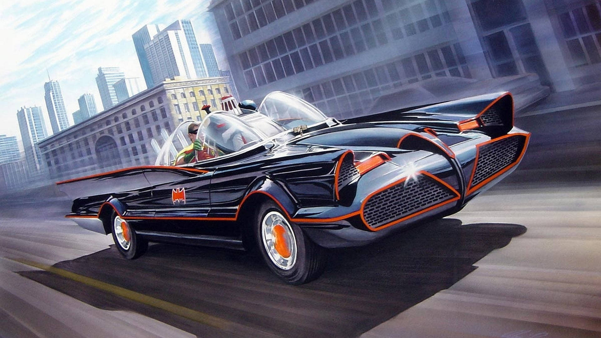 Dc Comics Batman 桌布 壁紙 — 一輛黑色和橙色的蝙蝠車在未來主義的城市景觀中疾馳，背景是高樓大廈。