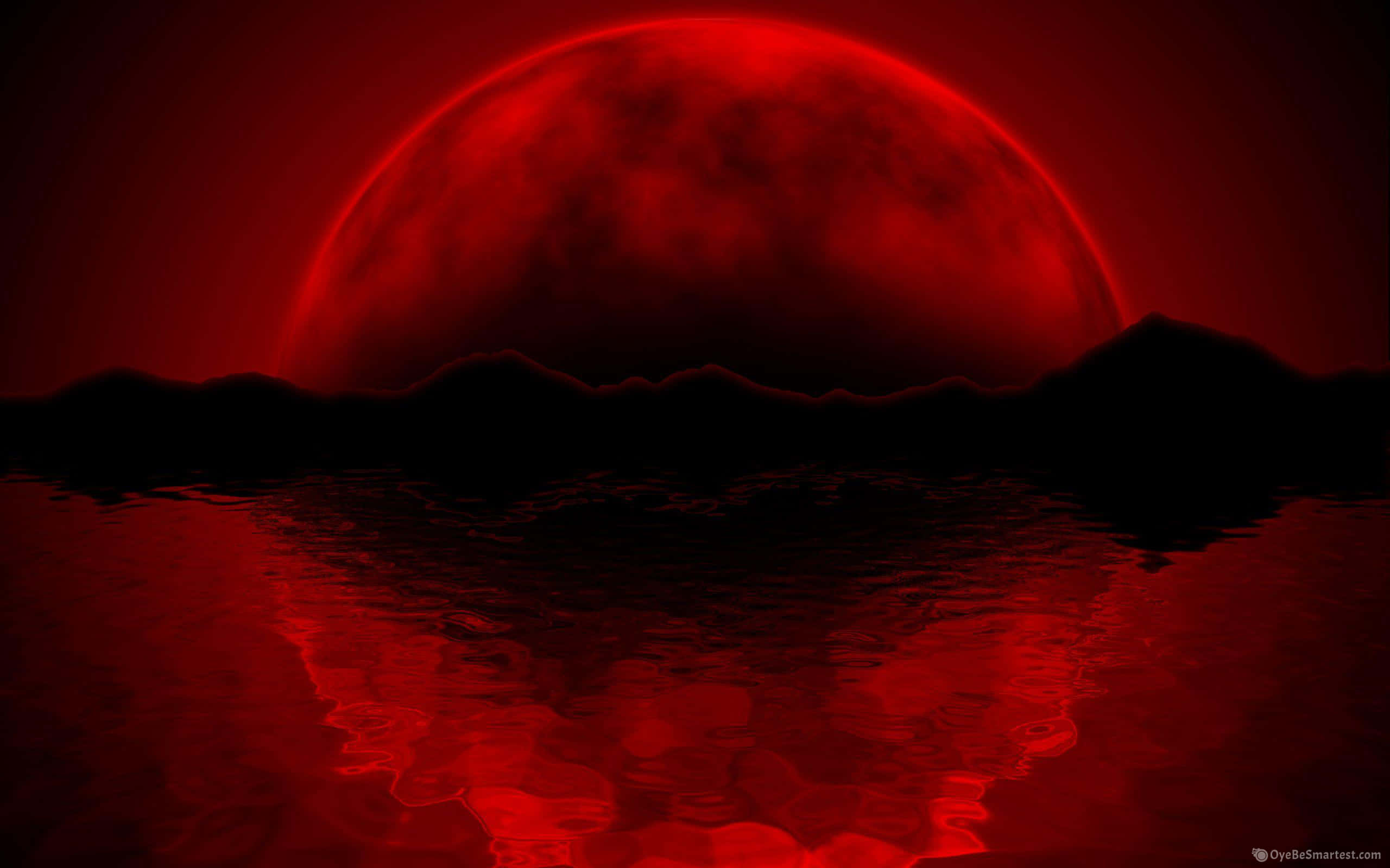 Red Moon 桌布 壁紙 — 一輪巨大的血紅色月亮籠罩在黑暗剪影山脈之上，倒映在漣漪的深紅水中。