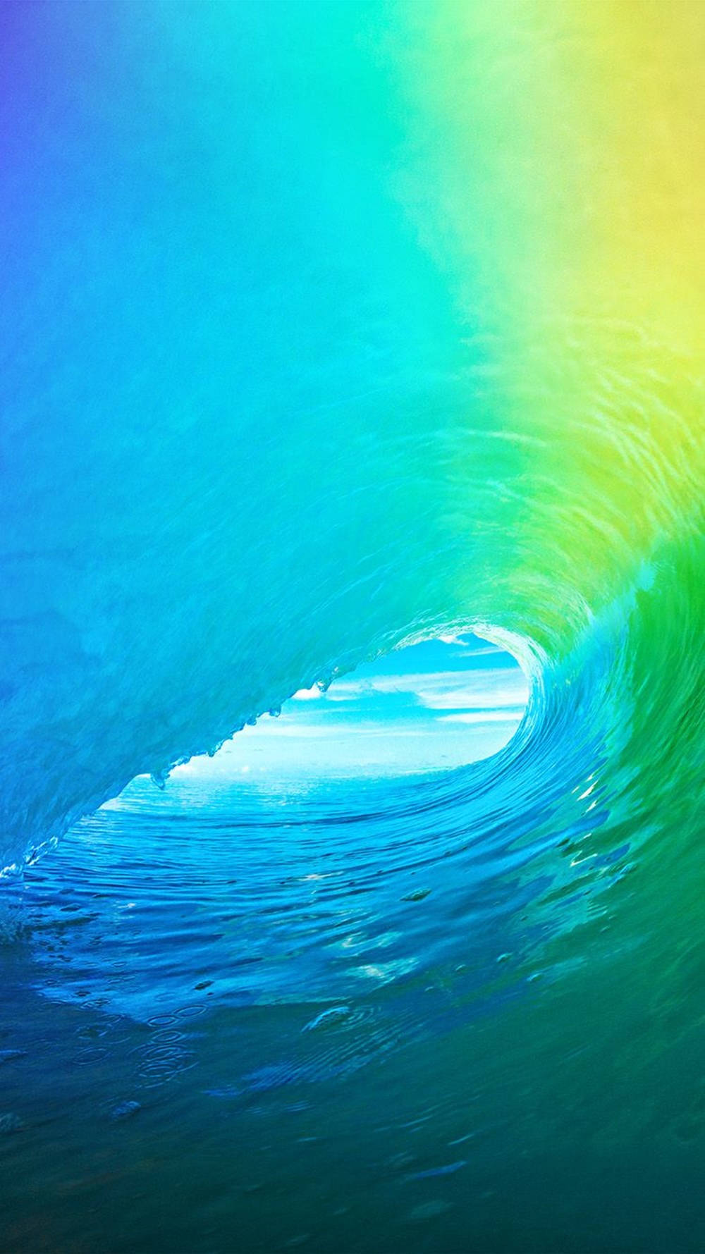 Ocean iPhone 桌布 壁紙 — 一道充滿活力的彩虹色海浪捲成完美的筒狀，陽光從其空心中心穿過。