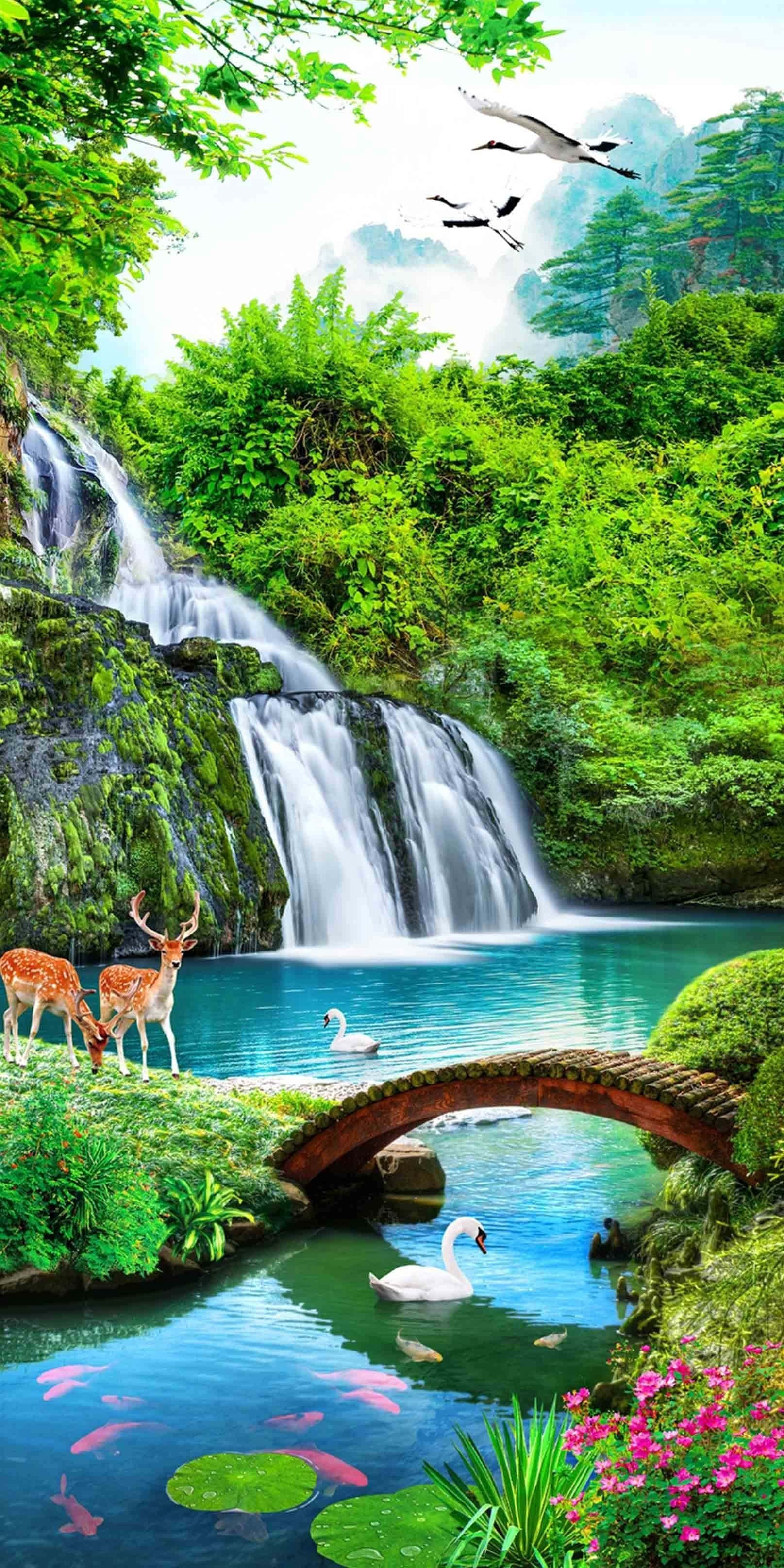 3d Waterfall 桌布 壁紙 — 一道充滿活力的瀑布穿過茂密的綠色森林傾瀉而下，鹿在石橋附近吃草，天鵝和錦鯉在橋下游動。